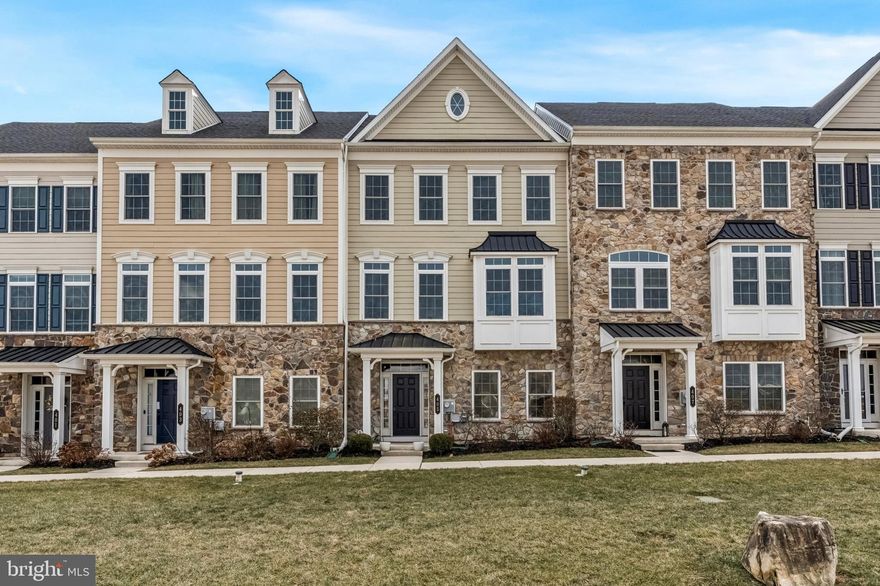 ​Welcome to this stunning, 4-level luxury townhouse ​located on a premium lot facing open space in the coveted ​Atwater community​ and the award winning Great Valley School District.   The home features an expansive light-filled layout and is an entertainer's dream featuring upgraded hardwood floors that lead you through a completely open-concept main level The gourmet kitchen is a true showstopper featuring an oversized island with chic pendant lighting and room for 5 bar stools​, premium ​quartzite countertops, ​beautiful subway tile backsplash, stainless steel​ appliances including double ovens, and a walk-in pantry make this a chef’s sanctuary. Adjacent to the kitchen, ​you'll find the oversized family room serves as the heart of the home, complete with custom built-in shelving, a cozy gas fireplace, and double atrium doors that open to a private composite deck—perfect for al fresco dining. A formal dining room with elegant crown molding and a convenient powder room complete this level.  ​Step upstairs and retreat to the​ luxurious master ​suite featuring a massive walk-in closet and a spa-like bath with a double-bowl vanity and an upgraded, oversized​ tile shower. Two additional spacious bedrooms, a stylish hall bath, and a dedicated laundry room ​complete this level.  The fourth level is the "crown jewel" of the home. This flexible space—featuring a full bath and a large walk-in closet—can serve as a fourth bedroom, a second family room, or a premier home office. Sliding doors lead to the private roof deck, offering a secluded spot to enjoy evening sunsets. The entry level provides ultimate convenience with ​access to the  2-car garage and a versatile bonus room featuring built-in cubbies to keep life organized plus there's lots of storage.  Living in Atwater means enjoying miles of walking trails, a 70-acre lake, and immediate proximity to the popular shops and dining of Malvern, all while being located in the award-winning Great Valley School District.