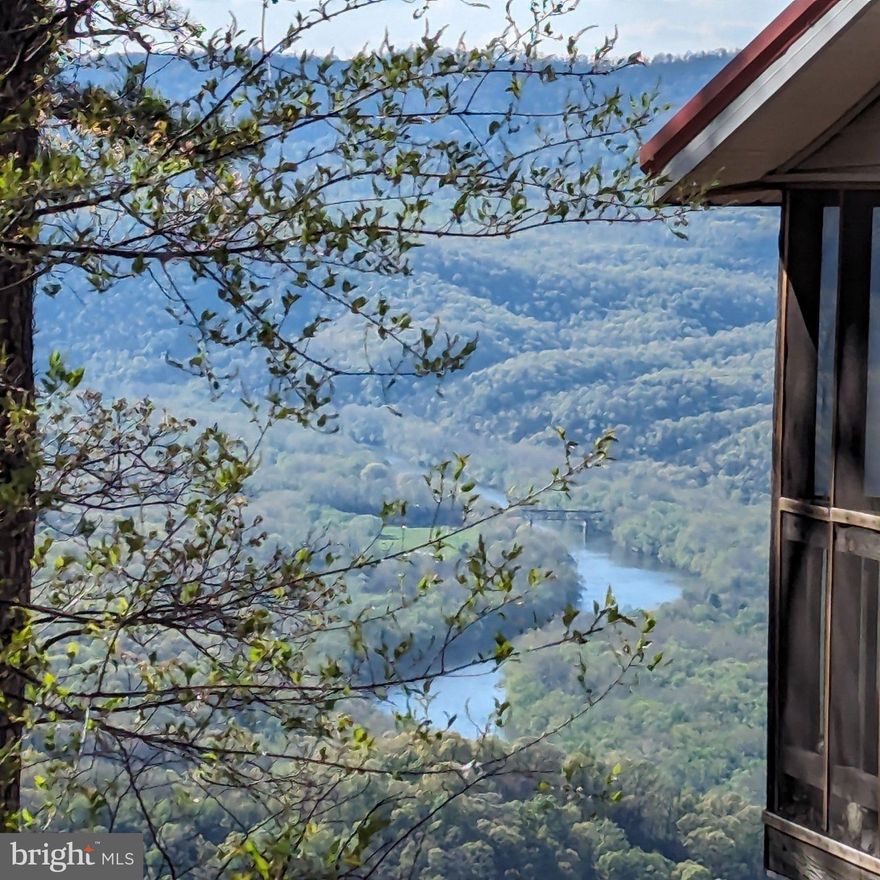 Savor every sunset from this beautifully updated and redecorated cabin overlooking both the river and surrounding mountains. The views alone will have you hooked—but step out onto the porch, and you may never want to leave.
Situated on 5.16 acres, this property offers plenty of space for parking, gathering, and enjoying the outdoors. Inside, you’ll find a comfortable layout with multiple sleeping areas, making it ideal for hosting friends, family, or weekend guests.
The kitchen, living spaces, and bedrooms come fully furnished and equipped with all the essentials, so you can skip the hassle and start enjoying right away. Just bring your clothes and your favorite drink—this place is ready for instant relaxation the day you close.
Whether you’re looking for a weekend escape, vacation rental, or your own private retreat, this Great Cacapon getaway delivers the perfect mix of comfort, convenience, and unforgettable views.
PROFESSIONAL PHOTOS TO FOLLOW