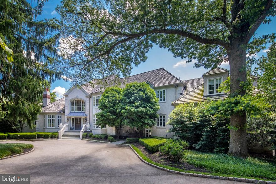 Grand French mansion-style estate at a premier Lower Merion Twp. address. Welcome to 837 Lafayette Road, tucked away from the main street down a long drive, you arrive home to your own green oasis on nearly 4 acres with a serene pond, swimming pool, tennis court and lush nature all around you offering the ultimate resort-like experience. The attention to detail inside is as exquisite, as is the quality craftsmanship evidenced throughout. A double-height grand foyer with a striking staircase and second-story balcony overlook greets your arrival and makes an elegant impression. Formal entertaining and casual relaxation are comfortably accommodated in the spacious living room with a wood-burning fireplace, theater/media room, formal dining room with a columned entry, adjoining gourmet kitchen with breakfast room, charming office/study, and coffered ceilinged family room with fireplace overlooking the beautiful trees and pond. Hosting a large crowd is effortless, with meals prepared in the top-of-the-line cook s quarters appointed with lacquered quarter-sawn custom cabinetry, stone counters and island, warm palette tones and premium-grade appliances. Floor-to-ceiling windows in the generously-sized main rooms offer picturesque views of the pool, tennis court and scenic landscape while inviting in abundant natural light. Multiple access points to expansive brick terraces facilitate seamless indoor-outdoor gatherings. Ascend either of two staircases to the tranquil bedroom level. Refresh and renew in the luxurious master suite complete with his & her closets and dressing areas, and a private office. The spa-like master bath with extra-large shower pampers you with refined finishes and a wonderful balcony that provides a place to unwind with a backdrop of lovely views. Of the 3 additional family bedrooms, one has an en-suite bath and two share a full hall bath. The basement cannot be overlooked - it is nearly 3000 square feet of an open floor plan with high ceilings and French doors that lead out to the pond - a great place for an in-law suite, a nanny s room, or a great play space for kids of all ages. A fully mirrored well stocked gym is also tucked away so that you can fully concentrate on your workout. An attached 3-car garage, separate detached 3-car garage, and circular drive afford plenty of parking for residents and visitors alike. This home has so much potential to be a fabulous entertaining home for any age family. It offers the perfect mix of an open floor plan and private rooms. This prestigious Bryn Mawr home is a rare treasure, in an unparalleled, convenient location.