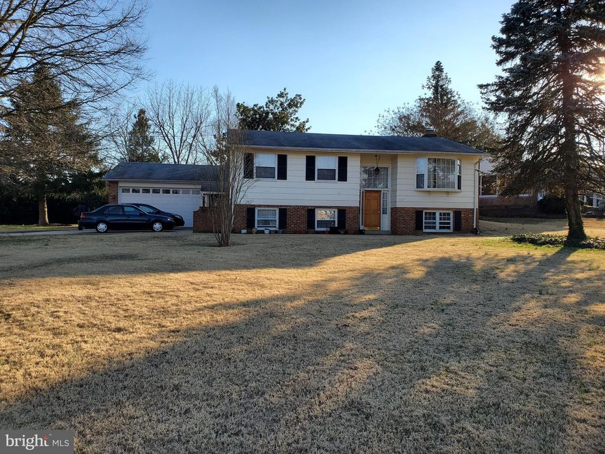 PRICED TO SELL!  Below market price, sold "AS-IS" condition.  Incredible yard, 2-car garage, drive-way, side and rear entrances.  Interiors will need updates/TLC.  FIRST TIME HOME BUYER'S DREAM!Split level foyer leads to main level and basement.  Basement has full bath, laundry room, and two flex space rooms, in addition to a large finished area and a FIREPLACE!  Main level features hardwood living room, 2 full baths, and 2 large bedrooms.THIS BARGAIN LISTING IS A MUST-SEE!