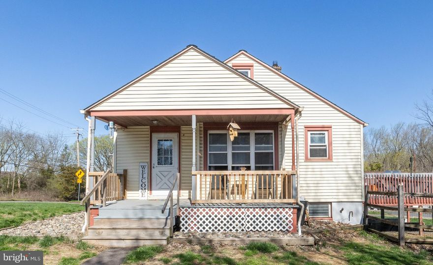 This charming bungalow is brimming with potential and just waiting for your personal touch. Step inside to discover the bright living area and wood laminate flooring that add warmth to the main level, which also features a kitchen, a cozy dining nook, two bedrooms, and a full bath. The semi-finished walk-out basement offers room for a third bedroom, and/or a home office. A generous deck overlooks the .62-acre yard, ideal for outdoor gatherings and serene mornings. Equipped with electricity and a storage loft, the oversized two-car garage is a dream for hobbyists and DIY enthusiasts. Plus, the extended driveway provides ample parking space for family and friends. Conveniently located near major roadways and the fabulous Philadelphia Premium Outlets, this property is the perfect blend of tranquility and accessibility. Don't miss the chance to make this delightful home your own! (Note:  The basement level is reflective of the fact that it has been used to train and board dogs. This property is being sold as is and is priced accordingly.)