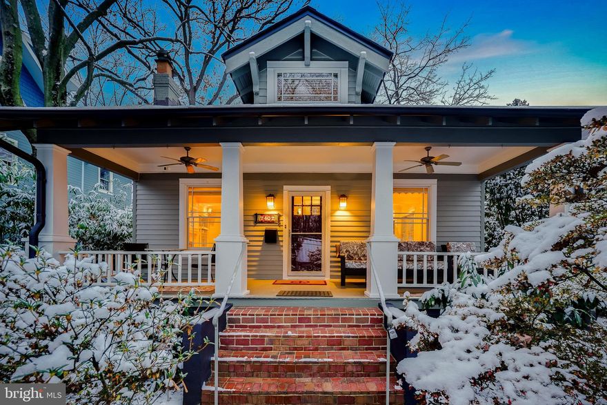 Welcome to 7402 Maple Avenue, an elegantly restored Craftsman-style bungalow—impeccably prepared for your immediate enjoyment. Originally built circa 1918, this home has been thoughtfully re-envisioned to blend classic charm with modern conveniences. Fine details stand out at every turn, from the rich wood trim and custom built-ins to recessed lighting designed to showcase your cherished artwork, hardwood floors, elevated hardware, stained glass windows, custom blinds throughout, and period-inspired accents.

A welcoming front porch with a tongue-and-groove ceiling and ceiling fans sets the tone. Step inside to an inviting living room featuring a gas fireplace, recessed lighting, and high ceilings. The spacious dining room, complete with built-in seating and storage, flows seamlessly into the redesigned kitchen, creating an ideal layout for gatherings. The chef’s kitchen offers granite countertops, stainless steel appliances, a Kucht gas range with integrated grill and dedicated hood, a porcelain farm sink, breakfast bar, pendant lighting, and well-crafted cabinetry. This space opens directly to the backyard and an expansive pebble-stone patio—perfect for entertaining!
The main level includes two comfortable bedrooms, one of which is the primary. Each enjoys crown molding, recessed lighting, and custom organized closet space. The primary bedroom offers exceptional storage with three closets, a built-in dresser, overhead cubbies, and a dedicated storage nook ideal for luggage. The updated full bath includes dual vanities, an Italian towel warmer, half-tiled walls, a soaking tub, and a corner shower. The upper level is a versatile third floor divided into four areas—ideal for sleeping, working, play, or crafts—and enjoys light from all four exposures along with generous eave storage.
The renovated lower level offers an impressive living space with wood-look tile flooring, a large family room with recessed lighting, a third bedroom, an incredible 6-person sauna, a stylish full bath with pebble-stone flooring, a steam shower with an aromatherapy reservoir and an Italian towel warmer, a laundry room with cabinetry and a sink, a walk-in pantry with a second refrigerator, and a storage/utility room.
The outdoor setting is equally appealing, featuring a terraced fenced yard with a permaculture design, mature landscaping, river rock accents, a corrugated steel shed with sliding barn doors, and a dedicated bin for garbage or firewood. A generous pebble-stone patio with a stone fire pit—conveying with the home—creates an inviting space for gathering. Additional conveniences include lattice storage under the home, a long driveway, and sidewalks along this highly desirable block in the heart of Takoma Park.
This premier location is just steps from the newly rebuilt municipal library and community center; close to new restaurants, shops, and the weekly farmer’s market; and only blocks from schools K–8—while being less than half a mile from the Takoma Metro! Ideally positioned between both downtown Takoma Park and Silver Spring, and near several local parks, this home offers vibrant in-town living with effortless access to dining, shopping, and transportation. See you there!