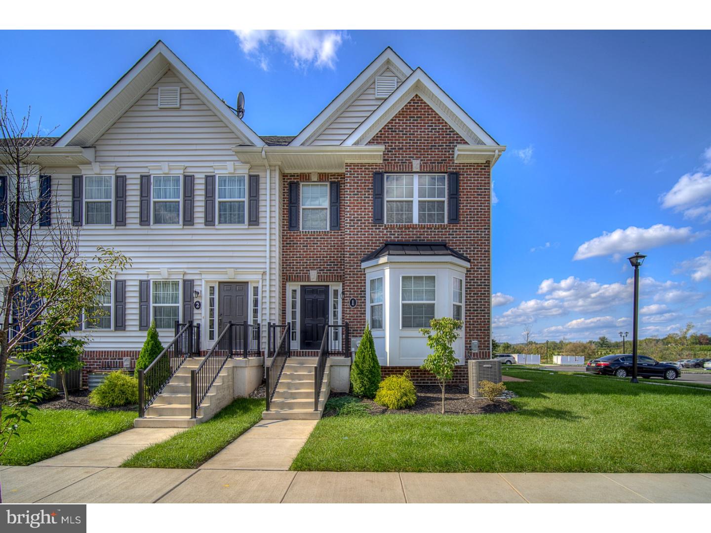 Why wait for new construction? This gorgeous 2 year old brick front end-unit home is move-in ready! Thoughtfully upgraded & lovingly maintained. Hardwood floors and 9 ft ceilings flow throughout the open floor plan of the main level. Upon entering the foyer, you will notice the living room with bay window and upgraded gas fireplace. The well appointed kitchen has been finished with 42" upgraded antique white cabinets, granite counters, stainless appliances & breakfast bar. The attached dining area lends access through sliding doors to a private paver patio with amazing sunset views over open space. Upstairs discover the owners retreat which boasts a vaulted ceiling & walk-in closet. The private owner's bath has been upgraded with 5' stall shower and his & sinks with extended height vanities. The second bedroom has a walk-in closet and it's own upgraded full bath as well. The basement has been finished with an egress that allows natural light to enhance the family room. Great location... walk to Hanusey Park, close to shopping & commuting routes.