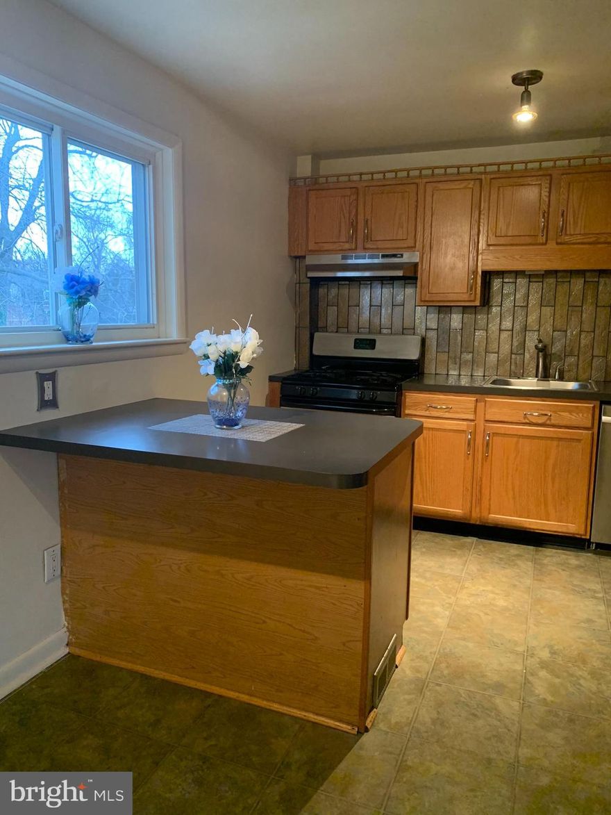 Spacious 1-bedroom apartment featuring an in-unit laundry with washer and dryer. Separate entrance. Rent includes utilities and Wi-Fi. The bedroom and living room are generously sized, and the kitchen offers ample storage. Appliances include a refrigerator, stove, dishwasher, and microwave. Located in a peaceful area opposite a park, the flexible lease accommodates your needs. Conveniently situated 1.5 miles from I-95/895, 3 miles from Morgan State University, and 6 miles from Johns Hopkins. Off-street parking is available.