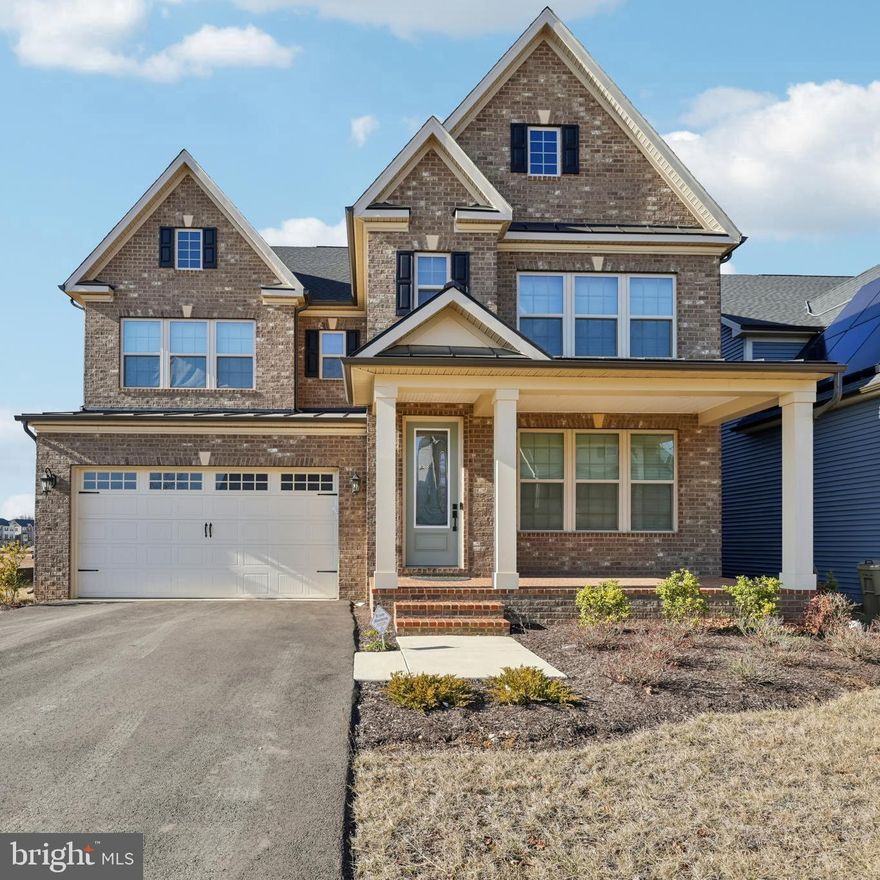 Welcome to Patuxent Greens. Why wait for new construction when you can move in now? This stunning turnkey home offers over 5,000 square feet of finished living space across three levels, featuring 5 bedrooms, 5.5 bathrooms, and a 2-car garage with a Tesla charger. A welcoming front porch leads into bright, sun-filled living areas with soaring ceilings and wide-plank engineered hardwood floors. The main level includes a versatile ensuite bedroom, ideal for multigenerational living or a home office, along with a formal dining room, mudroom, coat closet, and half bath. The chef’s kitchen is beautifully appointed with a massive island, quartz countertops, tile backsplash, pendant lighting, stainless steel appliances, double wall ovens, and a large walk-in pantry, plus an eat-in area that opens to a serene covered composite deck and flat backyard.

Upstairs features a spacious loft perfect for a study or play area, a chandelier-lit hallway, and an impressive owner’s suite with room for large furniture, dual walk-in closets including one with a built-in safe, and a luxurious spa bath. Three additional generously sized bedrooms offer walk-in closets and either private or Jack and Jill bathrooms.

The fully finished walkout lower level with a full bath is perfect for entertaining, movie nights, a home gym, or guest space. A large laundry room and abundant storage add to the home’s functionality. Residents of Patuxent Greens enjoy access to exceptional community amenities including a golf course, clubhouse, pool, lakes, playgrounds, green spaces, and walking trails. Conveniently located near Harris Teeter, Laurel Towne Centre, historic Main Street Laurel, and Riverfront Park, with the MARC station just 1.5 miles away and easy access to Washington, DC and Baltimore via major commuter routes.