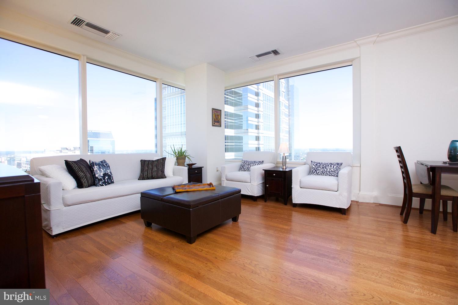 Luxurious One Bedroom plus Den or Two Bedroom, 2 bath apartment at The Residences at Two Liberty. Leave the vibrance of the city streets behind as you enter the hushed, private resident's lobby with door staff and concierge, at your service 24/7. "Fobbed" elevators give access to your residence as well as the 37th floor amenity level. The unit features a contemporary plan with high ceilings, gleaming hardwood floors, walls of windows throughout, and an open living room, dining room and kitchen which offers breathtaking views of the city. The chef's kitchen with granite counters has soft-close Snaidero cabinetry, built-in stainless Meile appliances and a SubZero fridge. Master bedroom suite includes a luxurious marble bath w/ glass enclosed shower and separate air-jetted tub, dual vanities, and a generous closet w/ built-in organization. A separate, private space currently set up as a den is well located and could easily be converted to a second bedroom. High efficiency stacked laundry in hall offering additional storage. With the finest amenities in the city, owners have access to a 24hr fitness center/spa with endless pool, steam showers, sauna, yoga studio and massage rooms. There is a business center with board room, billiards hall, a chauffeured luxury SUV, and direct resident access to Daniel Stern's outstanding R2L restaurant. Among the highest residential views in the city Liberty Two is right in the heart of Center City you are surrounded by the best shops and restaurants and are just steps to Rittenhouse Square, Dilworth Park, the Benjamin Franklin Parkway with world class museums; the PMA, Rodin and the Barnes Foundation. No details were overlooked. Additional storage is available on your floor and Seller is paying for 6 months Valet Parking right at your front door. Come see this Center City Dream Home today to experience unparalleled city living!