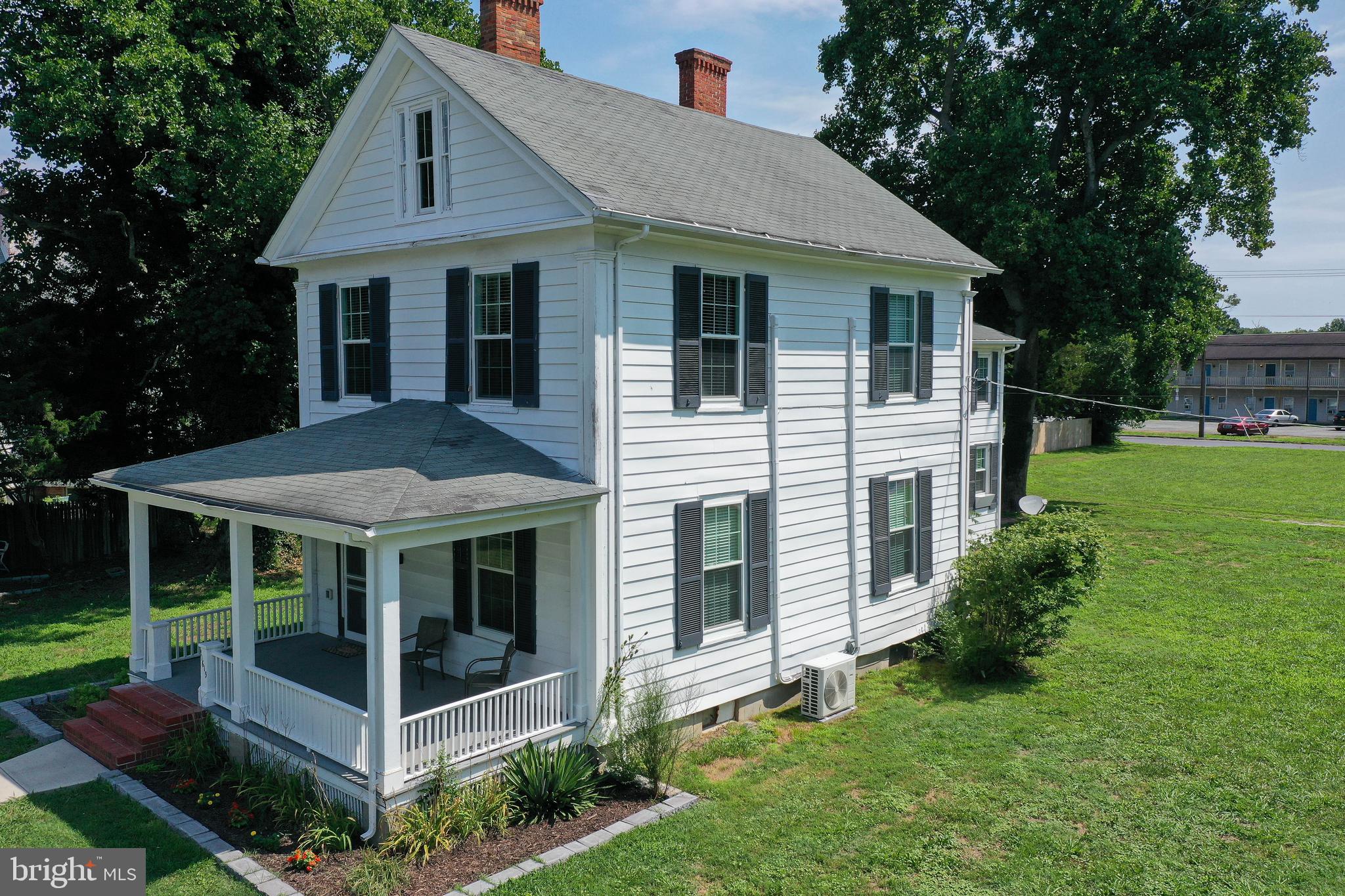 Step into a piece of history with this beautifully preserved and thoughtfully updated residence, originally built circa 1856 for Joseph Brinkley. Designed and constructed by renowned local craftsman Seth Venables — celebrated for his work in the Federal and Greek Revival styles — this stately two-and-a-half-story home seamlessly blends timeless elegance with modern convenience.
Set on a generous 0.73-acre double lot (with possible subdivision potential), the property boasts period features like six fireplaces — five functional and one decorative — along with stunning hardwood floors, a classic side porch (now screened for comfort), and a charming screened sleeping porch off the owner’s suite, perfect for enjoying the outdoors across three seasons.
The home has been tastefully updated with today’s needs in mind: thermal replacement windows, a mini-split HVAC system for room-by-room climate control, renovated kitchen and baths, all-new appliances, and newly installed insulation and vapor barrier in the crawl space. A brand-new fence runs the length of one side of the property, adding privacy and definition.
For hobbyists or those in need of flexible space, the detached garage has been enhanced with a concrete pad and is currently used as a workshop. Accessibility is also considered — the chairlift was recently repaired and comes with a transferable one-year warranty.
This one-of-a-kind offering combines historical significance, thoughtful upgrades, and development potential — all waiting for its next chapter to be written.