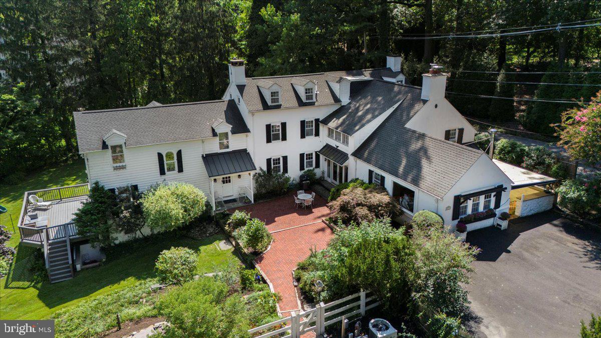 Step back in time with this historic Dutch- Colonial home, right in the heart of Rydal, Abington Township. Built in 1778, this remarkable residence sits on over 2 acres of private land and features six spacious bedrooms and 4.5 baths. The first floor truly shines with exquisite details throughout. Crown moldings and trim, deep windowsills, and even custom built-ins along with a grand fireplace. The kitchen and dining room quarters are perfect for entertaining. A gourmet kitchen is a chef’s dream, featuring stainless steel appliances, marble backsplash and a large center island with seating. A butler’s pantry makes all your storage needs complete! The adjacent breakfast nook leads to a charming terrace, perfect for morning coffee or evening relaxation.
In 1990, a two-story addition was completed, including a great-room with high-valued ceilings, wall-to-wall windows and glass doors opening to a deck overlooking the scenic backyard. A wet bar adds to the entertainment appeal. The second-floor addition includes a bedroom with ensuite bath. This luxurious bath is quite the showstopper! Heated flooring, a jacuzzi bathtub with window alcove, stand up glass shower and dual vanity with plenty of countertop space.
The second floor offers three more bedrooms with two baths, while the third floor provides two additional bedrooms and an extra full bath, alongside ample storage space. Some bonus areas include: an office with built-ins, entertainment room and wood burning stove, and finally a walkout basement.
The grounds of the property feature endless beauty with it’s wooded surroundings, flower beds, and two separate gardens. (one for vegetables, one for fruit) Perhaps, relax and enjoy the warm summer months in the large in-ground pool! There is even a basketball court for those sports enthusiasts. A detached 2-car garage which was originally called the “barn” provides extra storage and convenience. This historical- two century old home truly combines the best of both worlds… feel like you've stepped back in time, yet with all the modern comforts of today! Showings start Friday, September 12th.