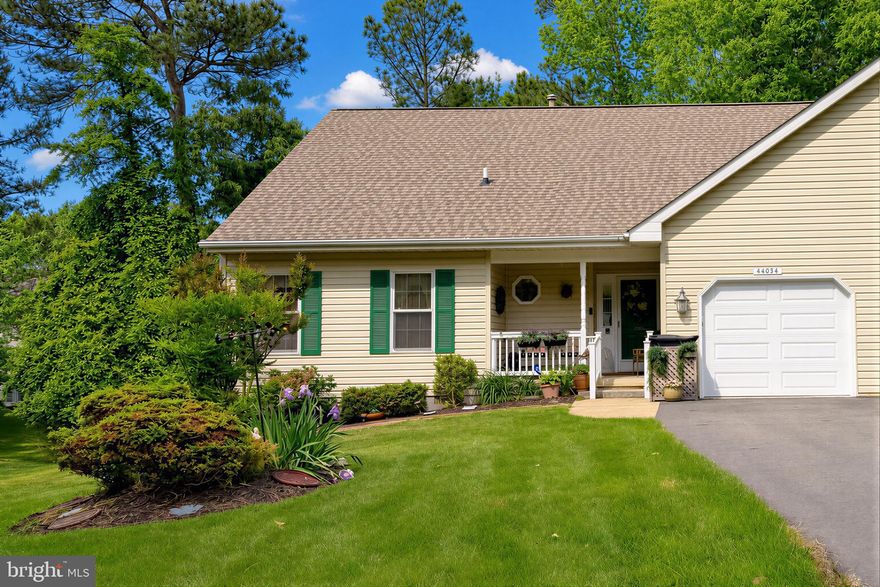Nicely updated cul-de-sac duplex in the 55+ Wildewood Retirement Village. This 2-bed, 2-bath home features Luxury Vinyl Plank flooring throughout, attractive light Oak cabinets in both kitchen and bath, Quartz counters, tile backsplash, stainless appliances, and a comfortable 3-season sunroom/open deck combo that backs to trees. New Andersen sliding doors w/ in-glass blinds are a highlight in the spacious living room. A formal dining room with pass through window to the kitchen makes entertaining easy. Enjoy nice weather on the low-maintenance composite deck, or relaxing in the cheery sunroom. Nice size bedrooms, primary with attached bath & walk-in closet w/ wall-mounted ironing board. Updated baths include easy-step shower w/ seat, soaking tub and shower/tub combo in hall bath. New door on the 1-car garage, and a recently resurfaced driveway. Roof, HVAC and water heater are all less than 8 years old, and for added comfort there's an ADT alarm system. HOA-covered lawn care, trash & snow removal make living easy, and clubhouse/community amenities can keep  you on the go. Great location, only minutes from shopping, movies, restaurants, and main roads. Don't miss this one, request your showing today!