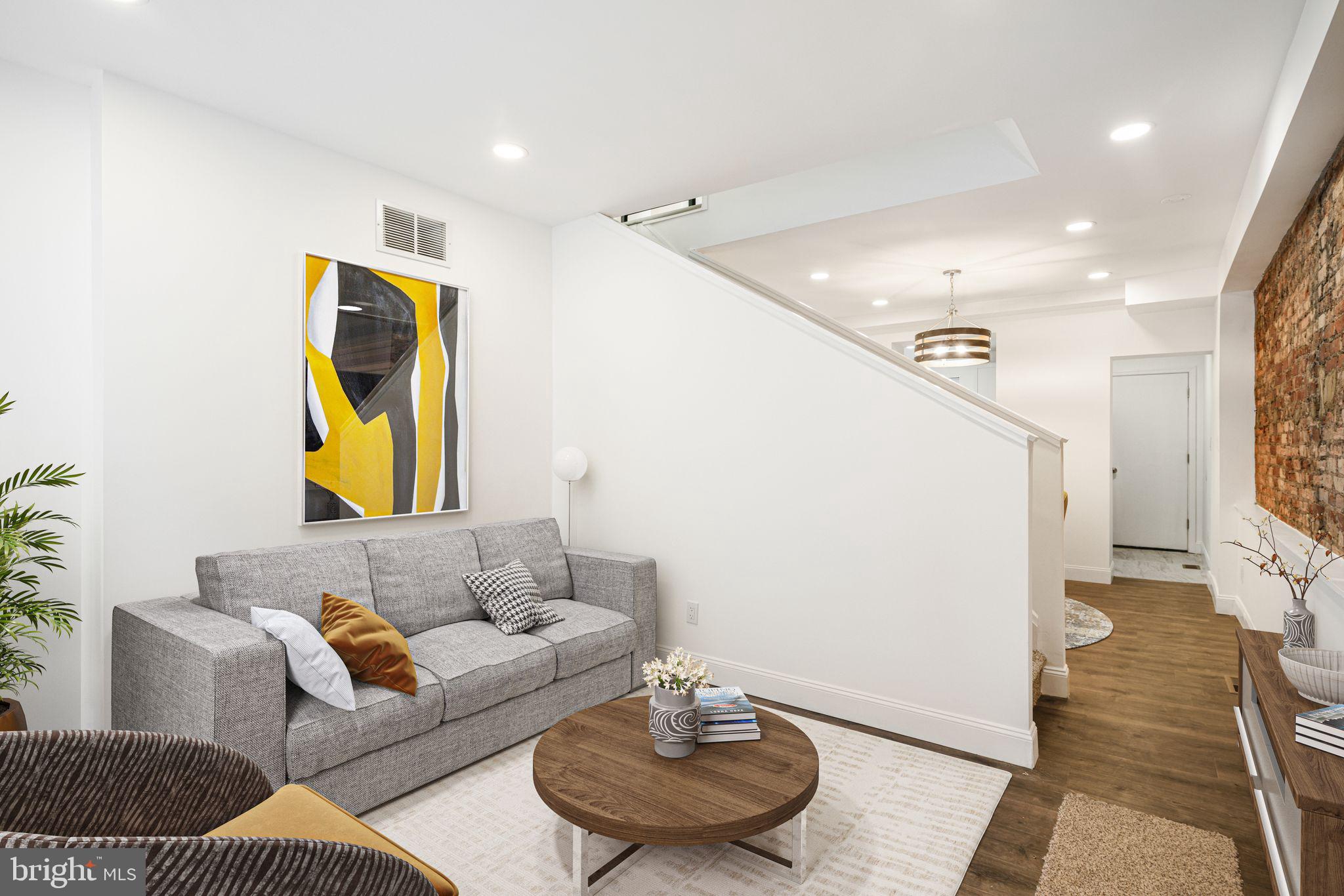 Welcome to 1219 Montrose Street, a stunning, fully renovated home in the heart of Bella Vista. This charming three-story residence seamlessly blends modern updates with classic character, featuring exposed brick walls, new flooring, fresh paint, updated electrical, and brand-new carpet throughout. Step inside to the inviting first floor, where natural light pours through the living room window, highlighting the beautiful new floors. The spacious dining area is perfectly sized for gatherings, complemented by unique built-in shelving and striking exposed brick accent wall. The sleek kitchen boasts stainless steel appliances, crisp white cabinetry, and a window over the sink, creating a bright and airy cooking space. On the second floor, you’ll find a spacious bedroom, a beautifully updated bathroom with a tile-lined shower and chic modern finishes, as well as a convenient laundry room. The third floor hosts the primary bedroom, an additional bedroom, and a second stylishly renovated bathroom. The unfinished basement provides ample storage space or the perfect spot for a home gym. Nestled in one of Philadelphia’s most desirable neighborhoods, this home offers easy access to vibrant shops, dining, and parks. Don’t miss your chance to own this move-in-ready gem!