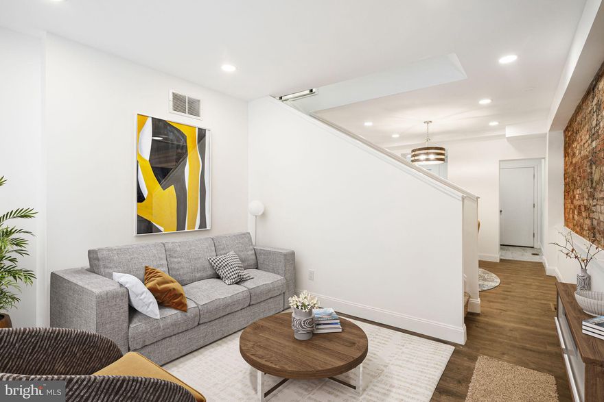 Welcome to 1219 Montrose Street, a stunning, fully renovated home in the heart of Bella Vista. This charming three-story residence seamlessly blends modern updates with classic character, featuring exposed brick walls, new flooring, fresh paint, updated electrical, and brand-new carpet throughout. Step inside to the inviting first floor, where natural light pours through the living room window, highlighting the beautiful new floors. The spacious dining area is perfectly sized for gatherings, complemented by  unique built-in shelving and striking exposed brick accent wall. The sleek kitchen boasts stainless steel appliances, crisp white cabinetry, and a window over the sink, creating a bright and airy cooking space. On the second floor, you’ll find a spacious bedroom, a beautifully updated bathroom with a tile-lined shower and chic modern finishes, as well as a convenient laundry room. The third floor hosts the primary bedroom, an additional bedroom, and a second stylishly renovated bathroom. The unfinished basement provides ample storage space or the perfect spot for a home gym. Nestled in one of Philadelphia’s most desirable neighborhoods, this home offers easy access to vibrant shops, dining, and parks. Don’t miss your chance to own this move-in-ready gem!