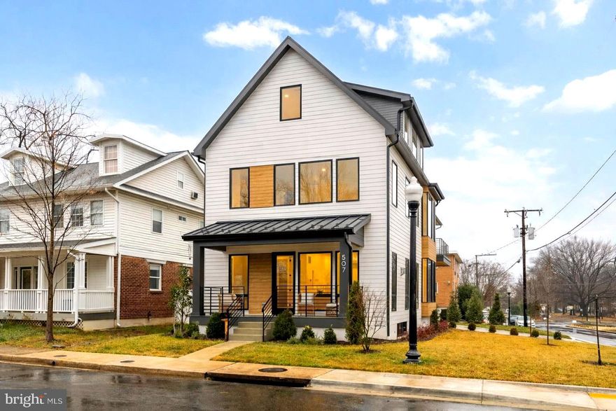 Brand-new, one-of-a-kind, and drenched in natural light—this custom Penrose masterpiece demands attention.

Set on a corner lot, the bold modern exterior pairs a striking black metal roof, warm wood accents, and floor-to-ceiling windows that flood every level with sunlight.

Inside, an open, multi-level layout showcases wide-plank hardwoods, designer lighting, and elevated custom finishes throughout.

The chef’s kitchen stuns with premium Thermador appliances, bespoke cabinetry, and an oversized statement island built for entertaining.

Customize the finishing touches with custom closets ready for your design and the ability to select paint colors for any room with a full-price offer.

The primary suite features a private balcony, and the landscaped yard opens directly to Penrose Park for seamless indoor-outdoor living.

Minutes to Clarendon, Columbia Pike, dining, parks, and DC, this is modern luxury in a classic Arlington setting—and a rare new-construction opportunity that needs to be seen now.