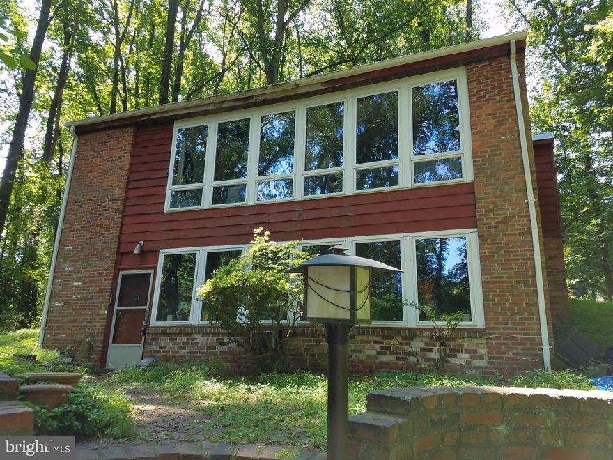 Fabulous Opportunity to update this secluded 1.8 Acre Lot with a mid-century-modern house within a 1.5-mile walk to Wolf Trap. "AS IS" CONDITION. Great Location, Adjacent to the Meadowlark Botanic Gardens with views of Lake Gardiner. BRING YOUR CONTRACTOR OR BUILDER.