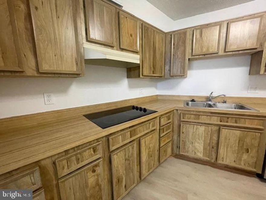 Montebello Condominiums is a well established and maintained condominium complex in Alexandria.  Unique arrangement of buildings allows full vantage of treed landscape and serene privacy.  The 114 unit is on the ground floor with an enclosed balcony allowing breathtaking view of mature trees.  This home is a 2 bed, 2 bath property with private Office/Den area allowing entrance from Living Room, yet doors to close for privacy.  Large Living Room and Dining Room for family gatherings.  Kitchen has new dishwasher and double oven. added to existing appliances of Refrigerator, and Laundry Center.  Luxury Vinyl Planks throughout with freshly painted Decorator White walls gives that clean spacious feel.  Baths upgraded with White Shaker Style vanities and Quartz countertops plus lighted bathroom mirrors for dressing.  Primary Bath has tub/shower unit, while Second Bath has walk-in soaking tub.  Closets throughout unit allow for ample storage of clothing, shoes and personal dressing items.  This vacant property is an Estate situation managed by Attorney/Executor and available for immediate showing and quick settlement.  Montebello is a diverse community with over 2000 residents offering abundant amenities, recreational activities, including indoor swimming pool for year round usage, outdoor swimming pool during summer season, fitness center, tennis facilities, Pickle Ball courts, basketball, walking trails, picnic and grills located on site, bowling alley available for residents, a formal Restaurant with Bar for dining pleasure, convenience store and Dry Cleaner on site, Hair Salon and Patrol Services to ensure safety throughout.