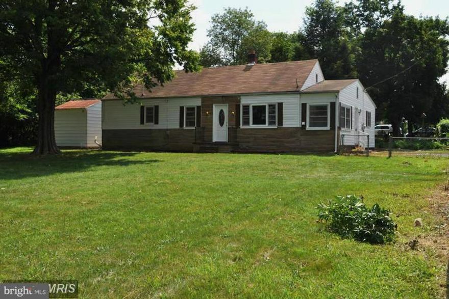 Solid mid-century home in quiet neighborhood. 3 bedrms, 1 full/1 spacious half bath. Large eat-in country kitchen w/custom built cabinetry & brand new stainless energy star appliances. Extensive renovation throughout w/all new flooring, interior & exterior painting, doors  & more. Fully fenced 1/2 acre w/ picturesque sunsets. Large outbuilding w/electric. Southern exposure laundry rm w/w/d hookups