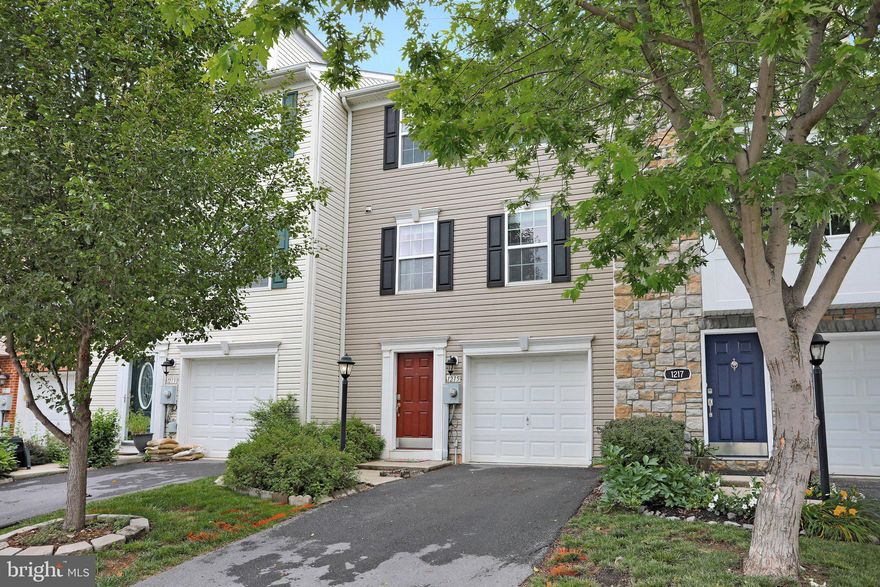This gorgeous  three level townhome in sought after Fairfax Crossing, features 3 bedrooms and 2 full and 2 half baths.   The Owners Suite has a walk-in closet, tray ceiling and en-suite bath.   The two other bedrooms share a hall bathroom.  The main level has a Living/Dining Room area and half bath.  The kitchen was remodeled with custom 42" cabinets, granite counters, center island, pantry and table area.  The home features a three level bump out, offering additional area in the basement, owners suite and  a bonus room area off of the kitchen.   The main level has hardwood floors.  The large open basement area offer flexible living space - rec room, home theater room, home office area - the possibilities are endless.  The basement opens to the backyard and features vinyl wood flooring, half bath and laundry area.  The welcoming foyer has a closet and access to the one car garage.   This home is move in ready and is close to amenities, commuter routes and restaurants.   Welcome Home!