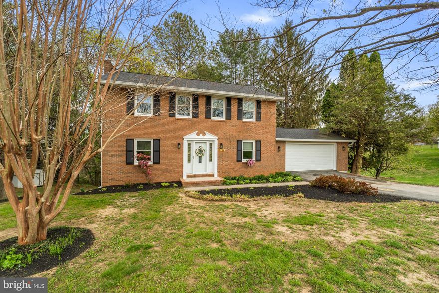 Beautifully updated brick colonial set on a private 1.28-acre lot in a peaceful Carroll County setting, offering three finished levels of comfortable, move-in ready living space.

The main level features a bright and inviting layout, highlighted by a fully renovated kitchen with white cabinetry, quartzite countertops, a large island, stainless steel appliances, and a striking herringbone backsplash. The adjacent living spaces are filled with natural light and centered around a classic fireplace, creating a warm and welcoming atmosphere.

Upstairs, you’ll find spacious bedrooms and updated bathrooms with refreshed vanities, tile, and fixtures. The finished lower level provides additional flexible living space, perfect for a recreation room, home office, or guest area, along with ample storage.

Major updates provide peace of mind, including a new A/C unit, hot water heater, whole house water treatment system, well system improvements, newer windows, updated garage doors, and gutters.

Enjoy the outdoors from the expansive two-level deck overlooking a private, tree-lined yard with plenty of space to relax, entertain, or play.

Ideally located just minutes from Sykesville and Eldersburg, with easy access to I-70, MD-32, and I-795, this home offers the perfect blend of privacy, convenience, and everyday comfort.

Call today for details or your private showing!