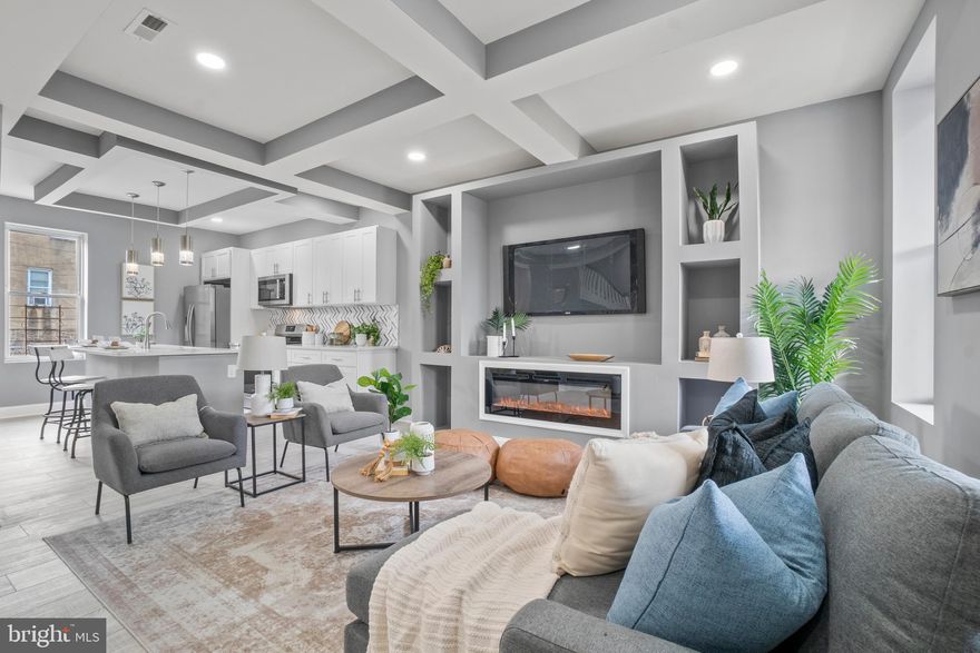 There is no place like home and 2126 N. Pulaski is your next home! Imagining walking onto your over-sized porch front and entering this beauty. As soon as you walk through the entry, you’re enamored by the attention to detail and craftsmanship. This open floor plan home is perfect for entertaining and hosting. The living room is cozy with its built in fireplace/custom shelving and transitions into a stunning eat-in kitchen. The eat-in kitchen features an island with double sinks, quartz counter tops, plenty of cabinet space with soft close, stainless steel appliances and a beautiful backsplash. Across from the kitchen, you will find a dining room with a meticulously designed grey accent wall that pairs well with the flooring. On the second level you will find 3 bedrooms and 2 full bathrooms including an Owner’s Suite with a private bath. The hallway leads to two additional bedrooms and another full bath. In the basement is a 4th bedroom and a full bath with a laundry area and private entrance. The backyard has ample space to make it your own! 2126 N. Pulaski is close to a neighborhood grocery store, mall and other shopping opportunities. You’re also in close proximity to Coppin State University, MICA, Johns Hopkins University, the Maryland Zoo, Druid Hill Park and the Gwynns Falls Trail. With easy access to I-83, you’re a quick trip from downtown and Towson. Submit an undeniable offer and call this home yours!