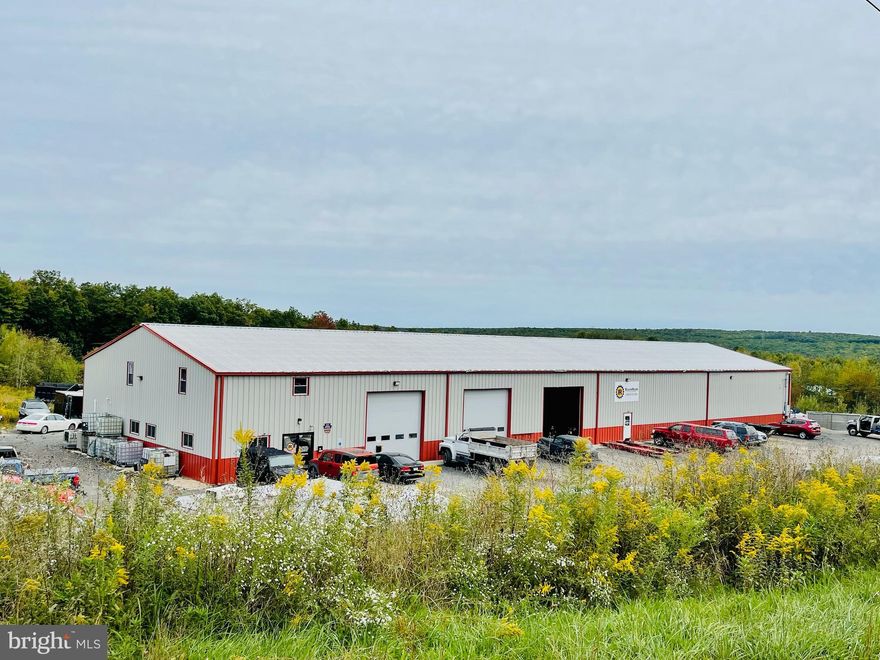 Location!  Location!  Location!!!   Just off Exit 124 of Interstate 81 AND situated on a 5.99 acre lot, you can't ask for a better site for your business.  Ease of access for employees, customers, deliveries, trucks, and cars alike mean the uses for this property are endless.  While the like new 12,000 square foot building is currently  being used as an inspection, repair, and custom detail garage, there's an abundance of possible uses.  A sprinkler system, 3 hydraulic lifts (14K pound 4 post, 12K pound 2 post, and 10K pound 2 post), as well as a 200 gallon garage wide air compressor system, Vehicle Scanner, Tire Balancing Machine, Miller 210 Welder, Plasma Cutter, 3 Floor Jacks, and 2 pallet jacks, are included as part of the sale.   In addition to the garage area, there is a 1500sq ft office area including a sales room, kitchen, 1/2 bath, and parts room.  There's also a 1500 sq ft second floor above the office area which includes a shower.  The building boasts of radiant floor heat,  a wash bay, waste oil furnace, 3 phase LED lighting, and a back up heat pump providing central air/heat to the office area.  Cable and Internet services are provided by Service Electric.  A building this size on a lot this size offers not just the ability to start your business but allows for expansion as you grow.   Additional land development requirements still exist through the township.  Contact listing agent for more information and to schedule a showing.  No drivebys or additional photos may be taken by prospective buyer's or their agents.  For this reason, in person showings only with 48 hour notice required to view.  Please note the sale is of real estate only not the business.