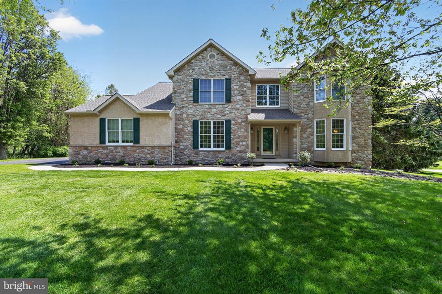 Welcome to this meticulously maintained 4-bedroom Colonial in the highly desirable community of Wetherill Estates in Chester Springs. Offering approximately 3,430 finished square feet, this classic home sits on a premium 0.80-acre level lot, backing to deeded open space with direct access to community nature trail and overlooking a private 9.5-acre community park—a truly exceptional setting. This home has been thoughtfully updated with major improvements, including a new roof, gutters, and downspouts (2024), HVAC system (2023), and water heater (2022). All kitchen appliances, as well as the washer and dryer, are included. Step inside to a dramatic two-story foyer featuring hardwood flooring and elegant crown molding, wainscoting, and chair rail detailing throughout the main level. To the left, the spacious dining room (16x12) showcases hardwood flooring and detailed moldings, offering ample space for large gatherings. To the right, the formal living room (15x14) features hardwood floors, recessed lighting, and upgraded trim. The gourmet eat-in kitchen (24x15) is designed for both everyday living and entertaining, featuring 42-inch custom cabinetry, granite countertops, tile flooring, tile backsplash, and a center island. The kitchen flows seamlessly into the cozy family room (15x19) with a gas fireplace and recessed lighting, along with access to a Butler’s pantry with glass cabinetry. A main-floor office or den with custom built-ins and scenic backyard views provides an ideal work-from-home space. Upstairs, the owner’s suite (15x17) offers wall-to-wall carpeting, a walk-in closet, and a spacious sitting/dressing room (15x13). The luxurious owner’s bath features a jetted tub, skylights, and a walk-in shower. The second bedroom includes wall-to-wall carpeting and a walk-in closet, while the third and fourth bedrooms are generously sized with neutral décor. Outdoor living is equally impressive. The two-tier rear deck (28x14) overlooks the private backyard, creating the perfect space for entertaining. Level front, rear, and side yards, combined with lush landscaping, complete this park-like property. Additional highlights include low taxes, low HOA fees, and location within the award-winning Owen J. Roberts School District, surrounded by 75 acres of deed-restricted open space. Conveniently located near shopping, parks, restaurants, and entertainment, with easy access to Routes 100, 401, 23, 422, and the PA Turnpike, this move-in-ready country oasis offers the perfect blend of privacy, convenience, and comfort.