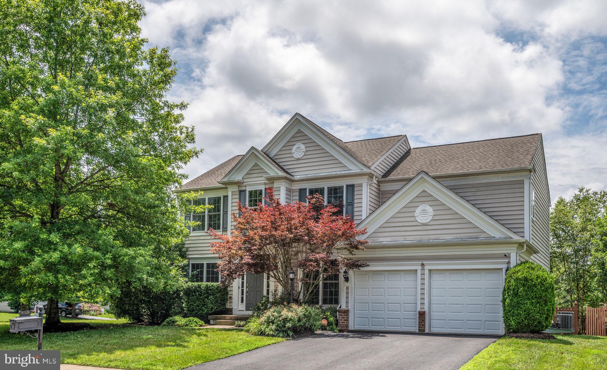 With three fully finished levels, this beautiful home offers a well-balanced blend of space, comfort, and refined style. From the lush, landscaped front yard to the thoughtfully designed interior, every detail has been carefully considered. Inside, you’re welcomed by a dramatic two-story foyer featuring rich hardwood floors, crisp white trim, wainscoting, and crown molding—all enhanced by the striking use of color that adds depth and personality to each space. To one side, a formal living room provides a stylish space for conversation or reading, while the elegant dining room on the other side is ready for holidays, celebrations, or dinner parties.
Continue into the heart of the home where the family room and kitchen come together in a spacious, light-filled layout perfect for everyday living and entertaining. The family room features large windows, while the adjacent eat-in kitchen is a chef’s dream—offering an oversized center island with seating, updated quartz counters, double wall ovens, and stainless-steel appliances. Warm wood cabinetry is complemented by a crisp white subway tile backsplash. A large sliding door connects the kitchen to the rear deck, making indoor-outdoor living and grilling easy.
Upstairs, the generous primary suite offers the kind of space you don’t always find—tray ceilings, soft natural light, and enough room for a full sitting area or workspace. The en suite bath features a large soaking tub, double vanities with granite counters, a separate shower, and plenty of cabinetry for extra storage and two walk in closets. Three additional bedrooms and a full hall bath offer flexibility for family, guests, or a home office.
The finished lower level provides even more living space with room for movie nights, game tables, or hobbies—and includes a full bath for added convenience. Whether you're looking for a hangout zone or a guest suite, this space can adapt to your lifestyle.
Out back, enjoy a fenced yard with a large deck, space for dining and lounging, and a hot tub—perfect for relaxing at the end of the day.
Additional highlights include a two-car garage, a separate laundry room on the main level, and easy access to major routes, VRE Stations, Old Town Manassas, shopping, dining and more! This home blends comfort and function with warmth, style, and attention to detail—from its thoughtful architectural touches to the inviting spaces inside and out.