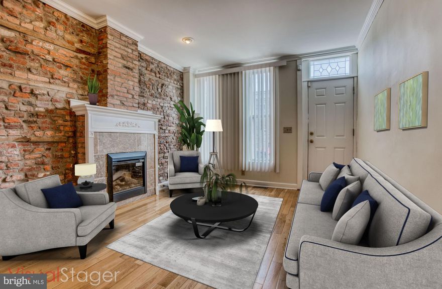 Washington Village/Pigtown rowhome recently renovated and waiting for you to make it your own. Main level features a spacious Open Floor Plan front to back with a living room, hardwood flooring throughout, dining space, laundry and 1/2 bath. Finished lower level with high ceilings, large storage area, and waterproofed with sump pump (rarity for the area)! Upper level features two bedrooms, one with a walk in closet, Full bathroom, a bonus desk/sitting space, new carpet and paint. Fully fenced in Rear yard with possibility to make parking. Short walk to U of MD- Baltimore, Restaurants, Camden Yards and M&T Bank Stadium. Quick access to MARC and major highways! Take advantage of the U of MD, Baltimore - Live Near Your Work program and get up to $18,500 in home buying assistance.