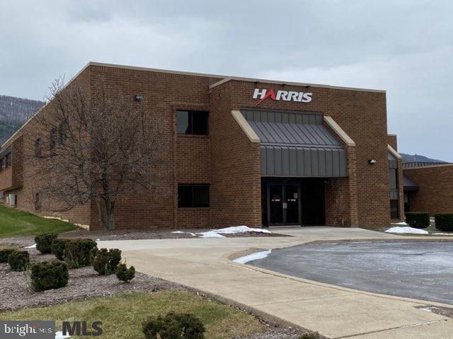 176 Technology Drive is a multi-tenant facility with a mixed use of office space and manufacturing. Currently there are five suites ranging in size from approximately 5,000 feet to 17,000 feet. Lease rates vary from $12 - $16/ft. The facility has unlimited parking for your company's needs and is conveniently located to 322 allowing easy access to routes 99 and 80. The facility has multiple loading docks, varied ceiling heights and has the ability to be further divided or combined depending on a company's needs. The setting is picturesque with views of Mt. Nittany out the front and Tussey Mountain to the rear. The building is the focal point of the Boalsburg Technology Park which has become an economic hub of Harris Township and Centre County, with many businesses locating along the contiguous Discovery Drive. This property is perfect for your investor buyer or for the end user. Endless possibilities. Condo Association maintains the common elements for the Park.