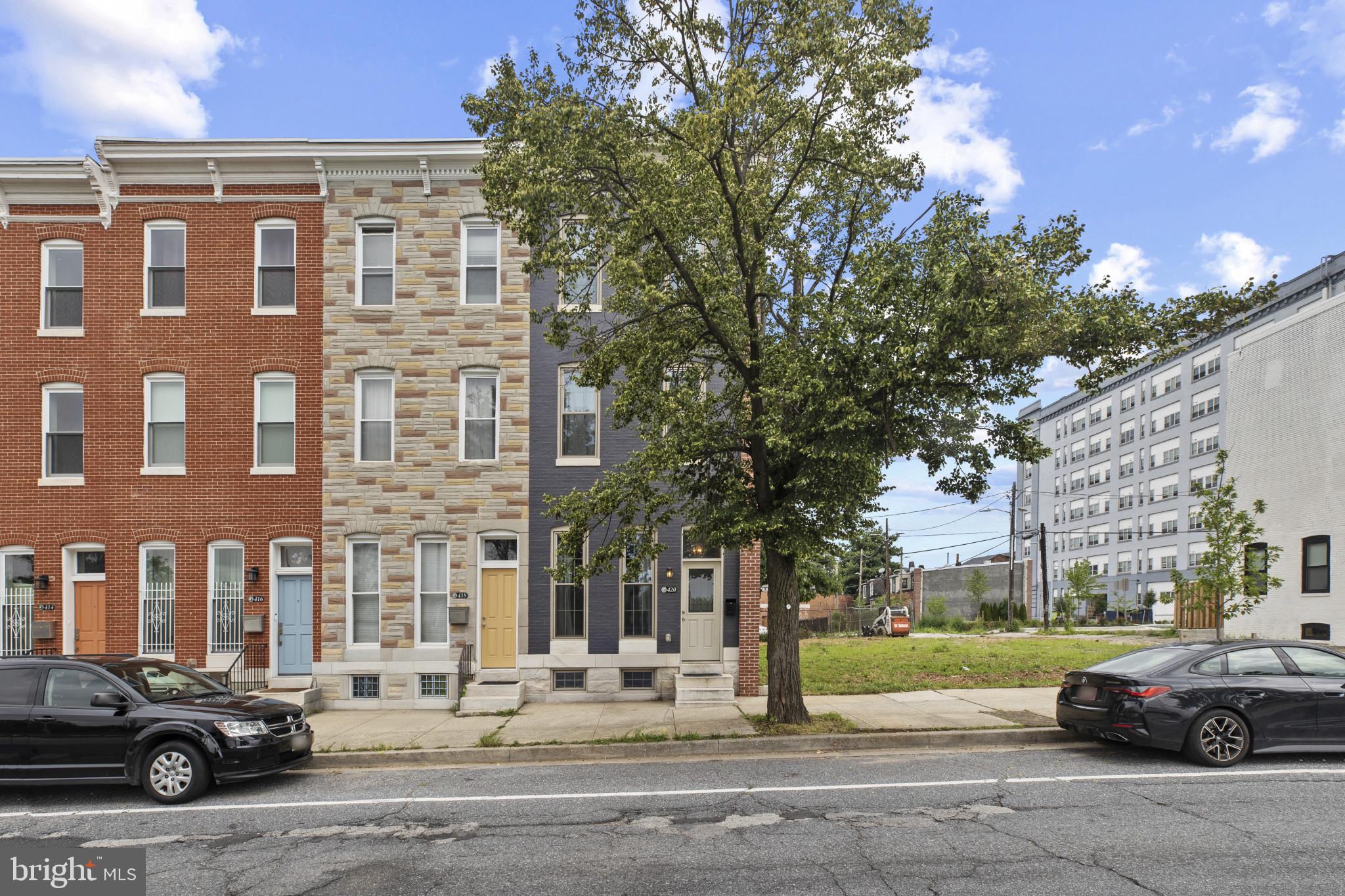 Just cross the bridge from Mt. Vernon to discover Johnston Square only one block away. This "next hot neighborhood" has arrived. Over the last three years, the area has undergone dramatic improvements and more developments are underway. This includes a new Pratt library and many new and restored buildings. 420 E. Biddle is an opportunity to purchase a beautifully restored townhouse unlike any other. This complete luxury renovation was designed and built for the owner to be his ultimate dream home. This is not a typical commercial flip. Its many quality features include red oak floors and tall ceilings throughout the house. Many original features, like its striking staircase were retained and enhanced with period designs. It features custom millwork and some antique chandeliers and light fixtures. There are several antique mantles and some exposed brick walls. While the home is open and airy, it has a classic but flexible floor plan. It offers an elegant yet cozy formal dining room. The primary suite occupies the second floor. It includes a large designer bath with a soaking tub, a spacious shower, and an oversized custom vanity. The floor and shower tiles are marble. This bathroom is very bright with its many windows. The laundry is conveniently located in this area. The primary suite also features a bonus space which is currently used as a sitting room or den. It could also be used for many other purposes such as a dressing room or an office. The top floor is the guest suite. Its layout mirrors the primary area. Its bonus room could be used as a third bedroom. The third floor bathroom is also spacious and features a soaking tub and walk in shower. This area has a separate heating and air conditioning system. The bright and spacious kitchen is out of a dream. It features custom cabinets - some with glass doors - and granite counter tops. The appliances are top quality stainless steel with gas cooking. The leaded glass entrance leads to a private fenced back yard. The large finished basement is tall and dry. This home has it all and is priced so much lower than similar homes nearby.