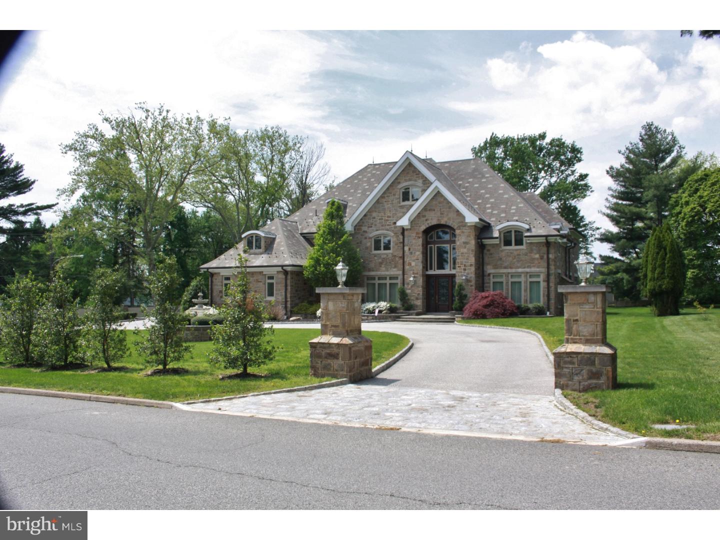Be a part of the vast history of what was the original A. Atwater Kent Estate. A Main Line Luxury home that cannot be surpassed, will have you in awe. This breathtaking 4 story, stone home situated on an acre lot features six bedrooms, 7 full baths and 2 half baths. As you enter the home, you are greeted by a 20' tall grand marble tiled entrance foyer boasting triple crown molding, lovely wainscoting & the focal point, the magnificent curved mahogany staircase. The chandelier is motorized to lower for dusting, cleaning & changing light bulbs! The first floor features formal dining room w/adjacent butler's pantry that includes refrigerator drawers & a dishwasher. The formal living room, music room/library & powder room w/barrel-chested bureau and hand-painted sink are ideal for large formal gatherings. When you want have more intimate functions, the gourmet kitchen has a large step-down granite top island, Wood-Mode cabinets & tiled back splash. Imagine the fabulous gourmet meals you can create with the Dacor 6-burner stove w/two ovens pot-filler above, plus an additional electric convection oven & microwave, SubZero refrigerator keep you well stocked. Off of the kitchen is the casual round family dining space with views of the garden, French doors to the covered slate patio & is open to the large fireside family room. The 2nd powder room & mudroom access the 3-car heated garage & completes the main level. The second floor features the master suite w/sitting room, closets that are like your own personal mall, large master bath including Jacuzzi tub, spacious glass tile shower, granite counters & cherry Wood-Mode custom cabinetry. There are 3 additional bedrooms on the second floor each with their own private bath plus & au pair suite w/private bath & sitting room. A laundry room completes the second level. On the third floor is the in-law suite w/kitchenette, bedroom w/large walk-in closet & sitting area as well as large bathroom w/Jacuzzi tub & glass rain shower plus loads of storage. Additional living space can be found in the lower level with an homage to Ruby's Diner done in red, white & blk w/kitchenette, large family room, theatre room just waiting for finishing touches, 2nd laundry room, full bath, dance studio/home gym, two utility rooms & plenty of storage. The home also features 3 tankless water heaters, separate meter for irrigation system, Dirt Devil house, generator. Your dreams have come true.