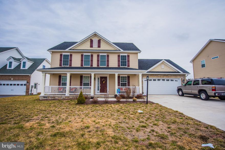 Beautiful 4 bedroom colonial with vinyl and stone exterior and front porch in Webber Springs that backs to pond. Hardwood foyer, formal living and dining rooms, family room. Kitchen has stainless steel appliances, floor to ceiling cabinets. Finished 2 car garage with belt drive opener. Master bedroom suite with 22 foot walk-in closet. Laundry room on both levels. One owner and well maintained.