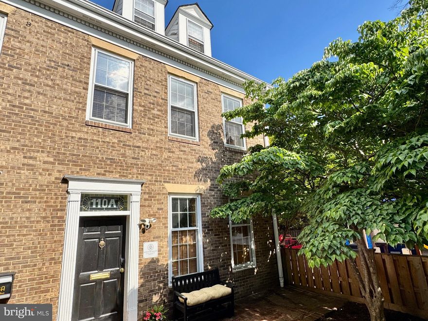 Welcome to Barrister Square! Tucked within a private courtyard just steps from vibrant King Street, this sun-drenched 4-level end-unit brick townhouse offers exceptional versatility in one of Old Town Alexandria’s most sought-after locations. Configured as two separate 2-level residences and currently operating as a popular short-term rental, this unique property presents an outstanding opportunity for owner-occupants, investors, or live/work buyers. MORE PHOTOS at Residential Listing VAAX2059284. 
Extensively renovated in 2022, the home features stylish modern finishes throughout, including updated baths with designer tile and fixtures, high-end lighting, in-unit Miele washer/dryers in both residences, separate HVAC systems and water heaters, hardwood floors across three levels, luxury vinyl plank flooring on the lower level, oversized windows, soaring ceilings, skylights, custom transoms, and a striking spiral staircase that adds architectural character and connects the upper residence to the loft level.
The upper residence features a full kitchen with island seating, granite countertops, spacious kitchen and dining area with soaring ceilings and skylights, a large bedroom with sitting area, main-level half bath, loft-level family room with built-ins, an oversized second bedroom beyond a custom sliding door, and a full bath with walk-in rain shower.
The main/lower residence offers two spacious bedrooms, including one with ensuite half bath, the other a Murphy bed, along with a full bath featuring a walk-in rain shower. The flexible lower level includes a kitchenette, built-in banquette dining area, fireplace lounge, separate flex space, second half bath, and laundry.
Outside, the charming, shared courtyard framed by mature trees and garden beds creates a peaceful retreat just moments from King Street’s acclaimed restaurants, boutiques, waterfront, Metro, commuter routes, and the free King Street Trolley.
Commercial Low zoning offers exceptional flexibility for residential, live/work, office, or rental use. An exceptional Old Town offering blending architectural character, flexibility, and investment potential in a premier location.
*Available furnished via separate arrangement with seller. Furnishings are personal property excluded from the real estate transaction.