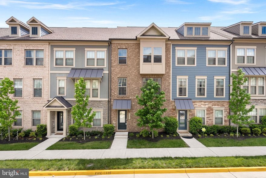 The home you've been waiting for! Walk into your basement through the front door or your two-car rear-load garage, which features a half bath and luxury vinyl plank flooring. As you walk up, you'll notice beautiful oak staircases and custom runner on all the stairs. Your large gourmet kitchen features a 9' kitchen island, quartz countertops, stainless steel appliances, and plenty of cabinet space. The spacious dining room leads seamlessly to your low-maintenance deck with Trex railings for entertaining perfection. Relax in the airy family room with fabulous windows that allow for the natural light to soar through. The third level features a luxurious primary bedroom suite with a walk-in closet and a bath with separate vanities, a stand-up shower with a bench, and floor-to-ceiling tile. The laundry room is located in the hall by the master, making laundry day more convenient. Two additional bedrooms are located here that share an upgraded hall bath with a tub and floor-to-ceiling tile. Community amenities include a pool, tot lot, clubhouse, and pickleball court. The nearby W&OD trail makes this great for bikers and hikers. Right off of Route 7, this fabulous home is walking distance to The Villages of Leesburg and its shops, restaurants, and entertainment. Five minutes to Downtown Leesburg, a quick two minute drive to the Leesburg Outlets and shopping centers, and less than ten minutes to One Loudoun make this location ideal for you!