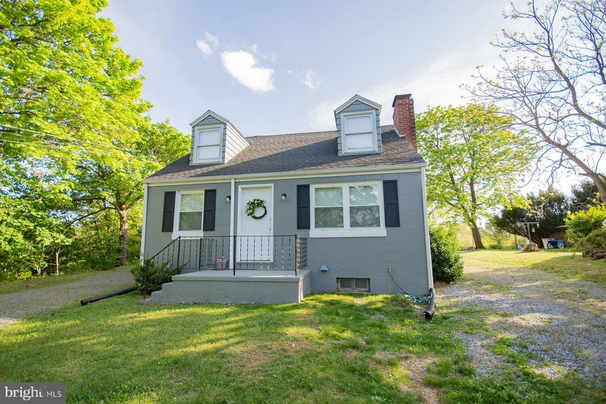Welcome to your Cape Cod haven nestled on a spacious, unrestricted .67 acre lot! This delightful home features 1379 sqft of living space with 2 beds, 1.5 baths, and main-level laundry for added convenience. Enjoy the charm of a front porch, a large rear deck, and a separate balcony off the bedroom. With new ductless HVAC, a 1-car carport, and a buyer's home warranty included, this home is both cozy and worry-free. Don't miss out on this perfect blend of comfort and style! Schedule your showing today!