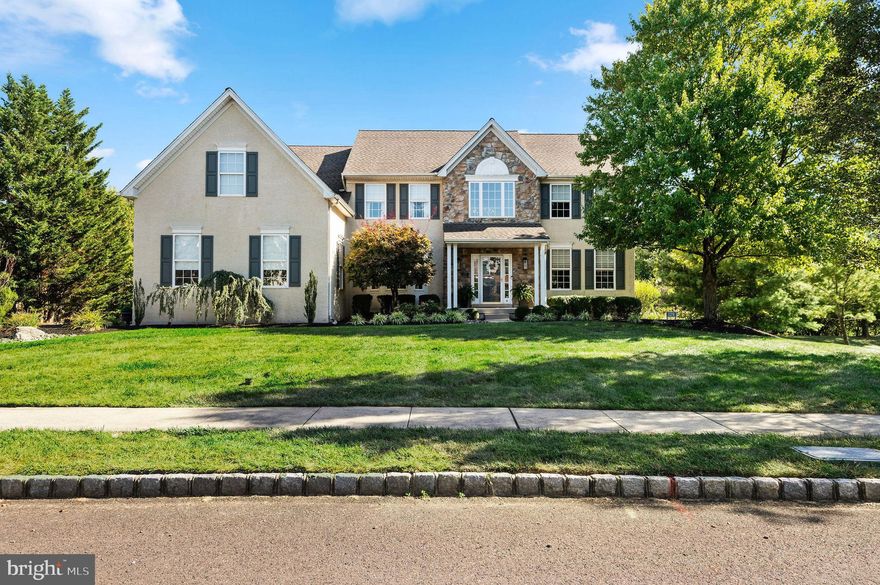 SELLER IS A LICENSED PA REALTOR.
PUBLIC RECORDS SHOWS THIS HOME AS A 3 BEDROOM INCORRECTLY.  IT HAS ALWAYS BEEN A 4 BEDROOM HOME
Welcome to this exquisite Classic Farmhouse in the prestigious Arbor Ridge neighborhood, where luxury meets functionality in a space perfectly tailored for modern living. Situated on a picturesque property, this home offers numerous upgrades and custom finishes, ensuring every detail has been thoughtfully crafted for both comfort and style.
Upon entering through the charming front porch, you’re greeted by a two-story foyer with dual coat closets and elegant crown molding. French doors lead to the sophisticated living room, while to the left, the spacious dining room creates an ideal setting for family gatherings, holiday celebrations, and special occasions. Both rooms are enhanced by custom window treatments, adding a refined touch of elegance.
The open-concept family room boasts a spacious layout, highlighted by a raised hearth stone gas fireplace adorned with a hammered copper beveled mirror. The dramatic two-story cathedral ceiling adds grandeur, making this room perfect for both relaxation and entertaining. Custom shades throughout provide privacy without compromising the home’s elegance.
At the heart of the home is a chef’s dream kitchen. Featuring granite countertops, double stainless-steel sinks, and a large center island with seating, this space balances style with practicality. Under-cabinet and over-cabinet lighting accentuate the glass subway tile backsplash, while recessed LED lighting ensures a bright, welcoming atmosphere. Premium Viking stainless-steel appliances include an electric oven, gas cooktop, and dishwasher, complemented by a beverage refrigerator and a water filtration system at the sink. A sliding glass door opens to a  composite deck with an under deck system to divert rain water away from the deck structure, preventing rot and moisture protection, offering an ideal spot for alfresco dining under the pergola while enjoying serene views.
The  mudroom area features a large double pantry for ample storage. Nearby, a half bath showcases a granite countertop, raised basin sink, and a new toilet. A private library/office, complete with built-in cabinetry, provides a quiet space for work or reading, with carpeting for added comfort.
Upstairs, the primary suite serves as a tranquil retreat, offering hardwood floors, a coffered ceiling, ceiling fan, and a spacious walk-in closet/dressing room with built-in storage and a makeup area. A beautifully refinished barn door, sourced from a Bucks County farm, leads to the spa-like en-suite bathroom, complete with a soaking tub, dual granite vanities, a large glass shower, and a new toilet.
Conveniently located near the primary suite is a well-appointed laundry room with built-in cabinetry. The hallway leads to three additional bedrooms: the second bedroom features a double closet, the third bedroom (currently used as an office) also includes a double closet, and the fourth bedroom is set up as a home gym. A full hall bathroom features double raised sinks, a granite vanity, and a new toilet.
The home's expansive walk-out basement is a true entertainer’s paradise, complete with recessed lighting, a gas fireplace, a granite bar, and a custom kitchenette with a dishwasher, microwave, and mini fridge. This space opens to a private backyard oasis, offering ample room for outdoor activities. With its generous size, this area could easily be transformed into an in-law suite, with plenty of room to add a bathroom.
The three-car garage provides the perfect space for weekend projects, featuring a built-in double bowl sink and countertop.
Located in the heart of Warrington, this home is just minutes from Valley Square shopping, excellent dining options, and the highly regarded Central Bucks schools.  Warrington Township also offers an array of parks and scenic walking paths, perfect for enjoying the natural beauty of the area.