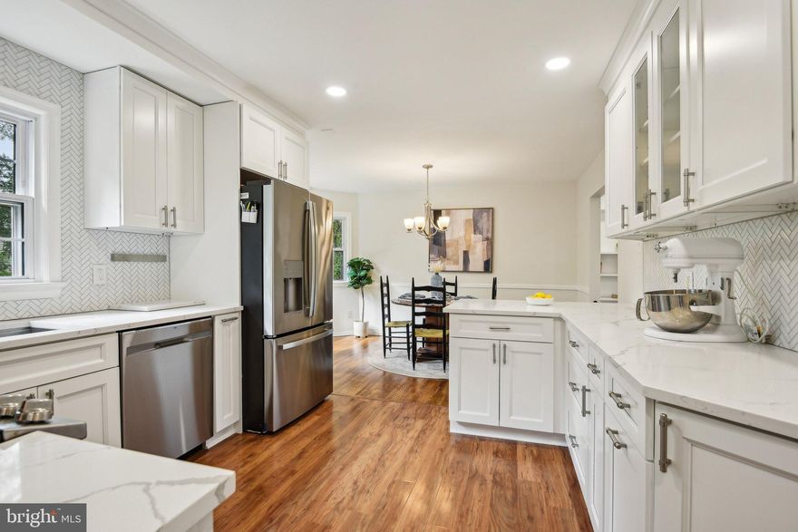 *Assumable 4.625% VA loan for VA Eligible buyers* Welcome to this beautifully updated 4-bedroom, 3.5-bath colonial on a generous corner lot in the desirable Stratford Landing neighborhood—situated on land that was once part of George Washington’s original Mount Vernon estate.

Step inside to refinished white oak hardwood floors throughout the main and upper levels, creating a seamless blend of charm and sophistication. The renovated kitchen (2022) is a chef’s dream, featuring white soft-close cabinets with custom pullouts, Calacatta Laza quartz counters, GE stainless steel appliances, and a premium Kraus workstation sink with built-in accessories. A spacious living room offers a cozy wood-burning fireplace, custom built-ins, and a bright bay window, while the large rear addition impresses with cathedral ceilings and opens to a newly refinished deck with a natural gas hookup—perfect for year-round grilling.

Upstairs, the primary suite includes a walk-in closet and a stylishly updated en-suite bath with a multi-function showerhead. Two additional bedrooms with new remote-controlled ceiling fans and a renovated hall bath complete the upper level. The finished lower level offers versatile space with a rec room, electric fireplace, full bath, laundry, storage room, and a fourth bedroom ideal for guests or a home office.

Recent upgrades include a new architectural shingle roof (2022), water heater (2021), and a powered shed for workshop potential. The attic is floored for extra storage, and double-hung, easy-clean windows enhance convenience throughout. Enjoy bbqs on the back deck, and as a bonus the back yard is fully fenced in!

Enjoy serene commutes along the GW Parkway and easy access to Fort Belvoir, the Pentagon, and Capitol Hill. Optional community pool membership adds the perfect neighborhood touch!