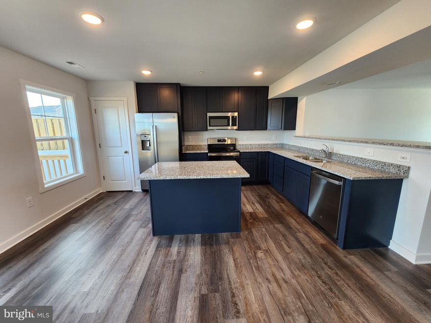 Last end unit available!!!
The Morgan townhome pre-sales. To be built with late August 2023 delivery. YOUR FIRST YEARS POWER BILL IS ON US!! Up to $10,000 closing cost assistance with your Lender of choice!
This two-story end-unit 3 bedroom, 2.5 bath townhome has an open concept design on the main floor w/ 42" soft close cabinets, a high low peninsula with granite top for entertaining, stainless-steel appliances, 12x16 deck off of dining area, a large living room w/ a bump out, coat closet and a half bath. The upper level features a large primary bedroom w/ cathedral ceiling, walk-in closet, double vanity and a walk-in tile shower; two guest bedrooms, one of which has a 2-story bump out, full guest bathroom, linen closet and laundry.  Throughout the home you will find recessed LED's, ceiling fans in the Primary bedroom & living room w/ each additional bedroom pre-wired for ceiling fans. High/Low outlets w/ pass through plates w/ CAT5/COAX/HDMI in Owner's bedroom & living room to make mounting your TV a breeze. You get more for your money with Four Points Construction. We are a featured loaded builder. Winner of WV Best in Class for Energy Efficiency - The Communities of Burwell has done it again! Pictures are of similar construction townhome; interior colors can be chosen by Buyer until  5/1/23.