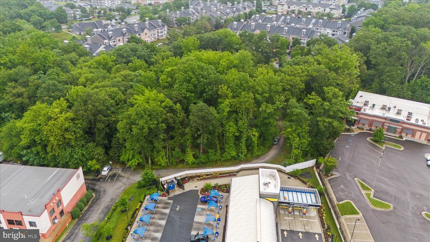 Highly sought-after Mixed-Use Property included in Odenton Town Center Master Plan Section 2.   Currently used as a family compound with garage with 1/2 bath. Directly in back of Odenton Self Storage with shared driveway easement.  SEE DRONE VIDEO FOR THIS PRISTINE PROPERTY !