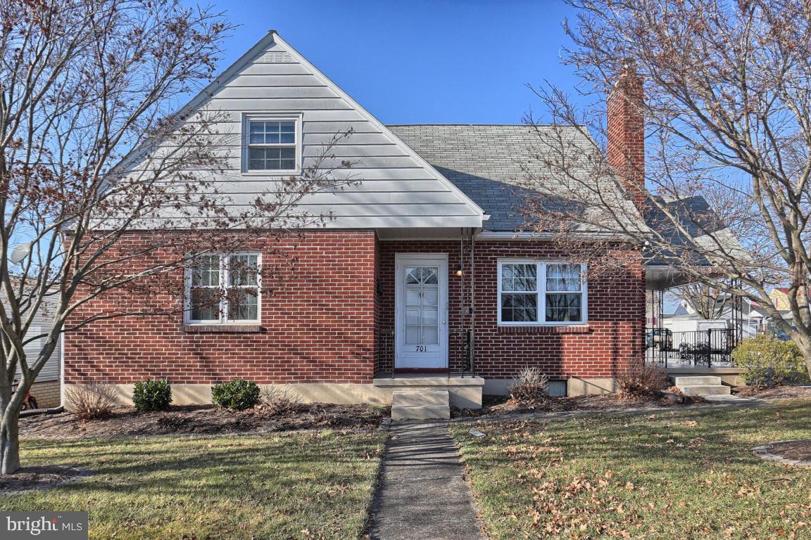 Beautifully maintained solid brick cape-cod home with a BRAND NEW KITCHEN, 4 bedrooms (possible 5th), hardwood floors throughout the main level, fireplace, cover side porch, nice long level corner lot, car port and 1 car detached garage/oversized shed. Unfinished lower lever with plenty of storage and room to expand!