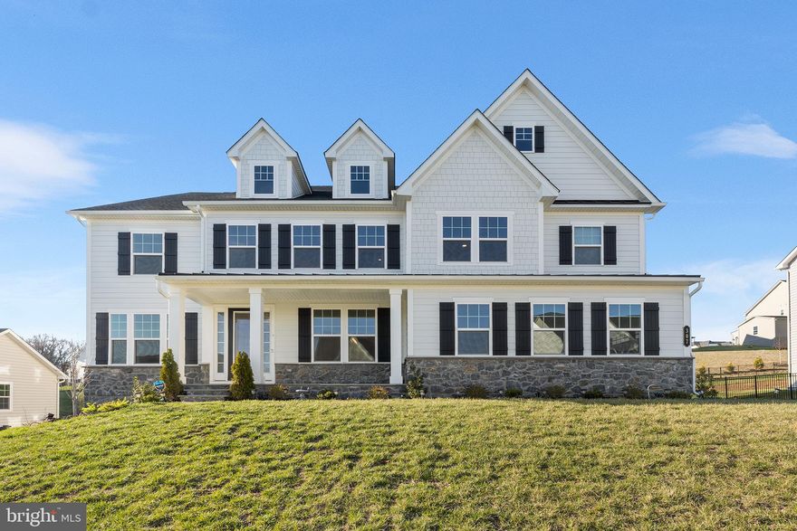 Move-in ready Stratford Hall model in sought-after Greystone is available for immediate occupancy! This spectacular one-year young home in West Chester school district, includes 4,400 sf of luxury living space plus an additional 2,000 sf of meticulously finished space in the walk-up basement.  The curb appeal starts with the extended front elevation complimented by a striking James Hardie and stone façade that's further accentuated by the inviting covered front porch with slate flooring. Inside, you’ll instantly be drawn to the light-filled foyer and eye-catching 6” hardwood, which has been upgraded throughout the main and upper levels. The foyer is flanked by a private office with glass panel French doors and an inviting flex space, ideal for a formal living or dining room. Across from the staircase is the first of 6 ensuites, a great option for generational family members or guests. Continue into the impressive two-story family room with a dramatic floor-to-ceiling Palladian-style window that's trimmed in striking millwork. From the family room, the open concept design flows into the state-of-the art gourmet kitchen with premium level white cabinetry, energy-efficient appliances, top-of-the-line quartz countertops, coordinating backsplash and a spacious walk-in pantry. There is an extended island with more than ample seating for four, a dining area for more informal meals and an impressive butler’s pantry with glass-front upper cabinets and quartz countertops. Adjoining the kitchen is the family entry with garage access and a roomy drop zone featuring built-in cubbies. Continue upstairs, where you’ll instantly be drawn to the luxurious primary suite. A private sanctuary with spa-like amenities such as walk-in shower with bench seat, dual vanities, quartz countertops, soaking tub, stylish tile, tray ceiling, custom designed California closets and more. The upper level also includes three additional generously sized junior suites, all with luxury finishes, an expanded loft upgrade and a conveniently located laundry room with built-in utility sink vanity. As an added bonus, the fully finished walk-up basement is thoughtfully designed with an expansive recreation room,  theater room with fully wired home theater system, and 6th bedroom suite. Suffice to say, this executive-style  home is turn-key with virtually every builder upgrade and then some. Additional highlights include but are not limited to upgraded electrical package with smart wiring and e-car charger, smart Ecobee climate control system with humidifier, remote controlled blinds, California closets, ceiling fans, black matte trim, and more.  Conveniently located close to shops, West Chester Borough, restaurants, Philadelphia and major highways. Showings commence with the open house on April 6th. (Note: taxes were successfully appealed and lowered!)