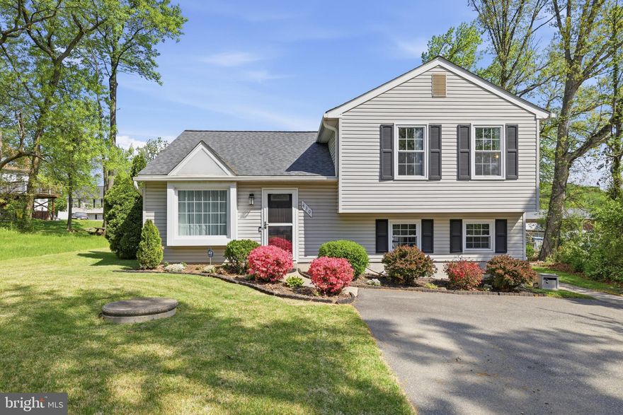 Meticulously maintained and continually updated, this beautiful home is a MUST SEE! Open concept with 3 bedroom 1.5 Bath, this Split level has too many updates to list.  The 2023-2025 gourmet kitchen remodel is the focal point of the home with modern 2 tone cabinetry, Quartz countertops, breakfast bar with seating, and SS appliances allows you to enjoy making every meal.  Window over the sink overlook large flat backyard.  DR walks out to deck overlooking backyard.  Upper 1 Primary with 2 spacious closets & updated ensuite bath. Lower level boasts large FR, Laundry and abundant storage.  LVP flooring thru-out the main level installed in 2024. Bathrooms remodeled in 2023 with new shower door, tub & floor in 2025, Crown molding allows for an elegant feel thru-out the main level.  Freshly painted and move in ready with new carpet in BR 2 & 3.  Also in 2023 the Front door and storm door were replaced,   Architectural Shingled roof was added, and new windows and sky-lites installed for reduced utility costs. Energy efficient heat pump 2021. Water Heater new in 2022 and so much more.   Driveway easily parks 3-5 cars.