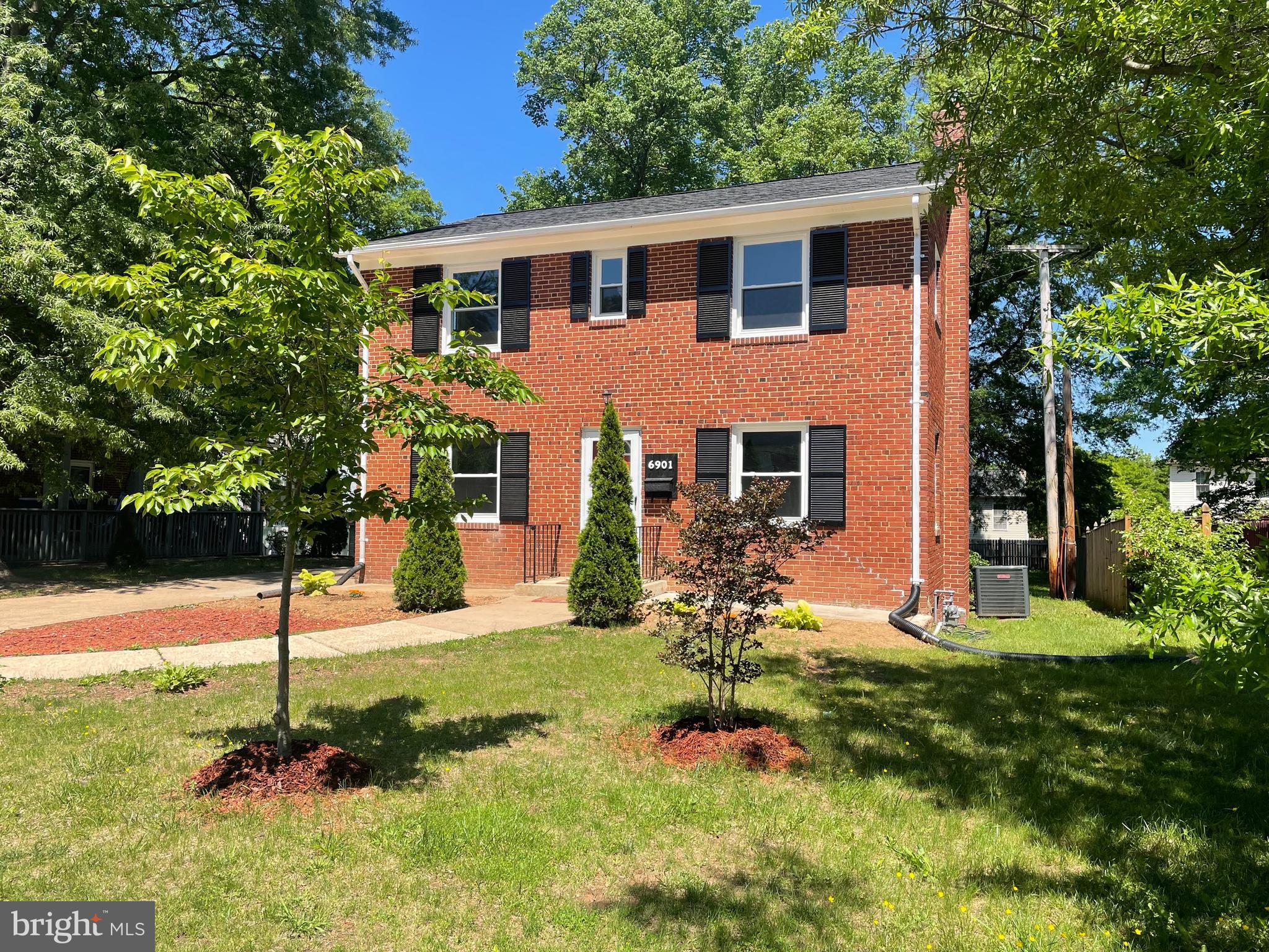 Updates have been to the property based on comments from the initial showings. Still three level brick colonial with five bedrooms (with potential seven bedrooms), three and a half bathrooms, and a very big yard. Large new kitchen on main level with new appliances, and potential kitchenette in the basement; both with quartz countertops. New HVAC system and separate split unit for the master bedroom. New roof, new windows, and new water heater. Reconditioned hardwood floors on the top floor, with matching vinyl laminate flooring on main level. More than enough parking spaces; a rare find in the Lanham/Greenbelt area. Priced right to sell fast !