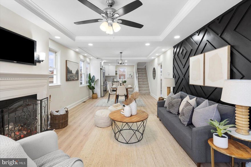 Step inside this beautifully renovated Cape Cod and experience a perfect blend of character, style, and contemporary design. Thoughtfully updated from top to bottom, this home offers bright, inviting spaces and high-end finishes throughout.

The main level welcomes you with luxury vinyl plank flooring, recessed lighting, and an abundance of natural light. A cozy fireplace warms the living room, creating the perfect setting for movie nights or relaxing evenings at home. The open floor plan seamlessly connects the living area to the gourmet kitchen, complete with stainless steel appliances, quartz countertops, and ample custom cabinetry—ideal for those who love to cook or entertain.

Two spacious bedrooms with plush carpeting are located on the main level, offering flexible options for guests, a home office, or multigenerational living.

Upstairs, the expansive primary suite provides a serene retreat. Enjoy a large bedroom, an inviting sitting room perfect for reading or unwinding, and a beautifully renovated primary bath featuring a modern walk-in shower.

The fully finished lower level adds even more living space with a generous family room and two additional bedrooms, all with durable LVP flooring. Perfect for a media room, home gym, playroom, or extra guest space.

Outside, the large fenced-in backyard is ideal for gatherings, pets, or gardening. A detached garage offers additional storage or workshop potential, and the long driveway provides plenty of parking for multiple vehicles.

Location truly sets this home apart—situated in a highly desirable area close to popular local restaurants, charming cafés, boutique shops, grocery stores, and everyday conveniences. Enjoy the ease of having vibrant community amenities just moments from your doorstep.

Meticulously updated and ideally located, this home offers the perfect combination of comfort, style, and convenience. A must-see!