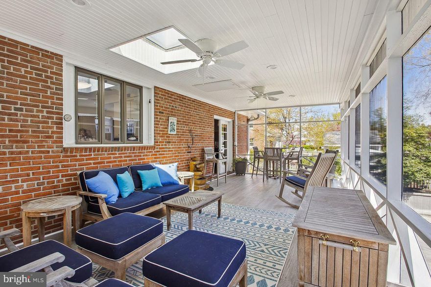 This mid-century modern brick home is a unique find in the coveted Murray Hill community of downtown Annapolis.   Enter to find expansive one level living and a finished walk out basement featuring an in-law/au pair suite with a separate entry.   The property also features a large yard and driveway, with parking for up to 6 cars.  All of this within a 5 minute walk to the heart of downtown Annapolis and several street end parks providing water access to Spa Creek.

The double door entry leads to a foyer and expansive living room with crown molding, recessed lighting and a gas fireplace with a stacked stone surround.  The dining room has french doors leading to a large fully screened back porch, the perfect hang out space for entertaining family and friends.  The kitchen with classic white cabinetry, granite countertop and a timeless subway tile backsplash overlooks the screened porch.   The original divided casement windows provide mid century character and plenty of natural light. Oak hardwood floors are found throughout the main living areas,  and the original solid wood doors add to the unique character of this home.

The bright main level primary bedroom features an en-suite bathroom and very large closet space.  Two other bedrooms on the main level have large  windows overlooking the backyard and share a hall bathroom.  

The basement level offers a recreation room and full bathroom, and an expansive laundry room with potential to enlarge and reconfigure the current space.  The  in-law/au-pair suite has both interior access from the basement, and a separate exterior entry on the side of the home allowing for ground level entry access.  This charming apartment features an open concept living space with an adorable white kitchen, quartz countertops and stainless steel appliances.   The basement still has a significant portion of unfinished space providing ample room for storage.  The home also features a walk up attic with full interior staircase that  provides even more storage, and the option to consider expanding the home if desired. 

The driveway provides parking for up to 6 cars with a covered parking area along the rear of the home.  A custom shed houses gardening tools, bikes and other toys.

Murray Hill is a quiet walkable community within a few minutes of Main Street Annapolis and many nearby restaurants and shops.   Kayaks and paddle boards can be put in at any of the street end public docks, and residents may apply for city mooring ball permits  in Spa Creek and other nearby creeks as well.