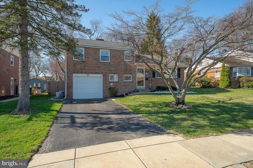 Welcome to this beautifully reimagined 3 bedroom, 2 bath brick split-level residence, thoughtfully renovated from top to bottom in 2024, offering a seamless blend of modern design and comfortable living. A bright, open-concept layout welcomes you, enhanced by expansive windows and abundant natural light throughout. 

At the center of the home, the stunning kitchen has been meticulously designed with crisp white cabinetry, granite countertops, tile backsplash, stainless steel appliances, breakfast bar seating, built-in storage, and a beverage refrigerator. The space flows effortlessly into the living and dining areas, creating an ideal setting for both everyday living and refined entertaining. Just beyond the dining area is a spacious rear patio overlooking a private, fully fenced backyard, perfect for outdoor gatherings or quiet relaxation.

The upper level offers a generous primary suite with two large closets and multiple windows, along with two additional well-proportioned bedrooms, each filled with natural light and finished with new carpeting (2024). A beautifully renovated full bath completes this level with timeless finishes.

The lower level provides exceptional versatility, featuring a spacious family room and a stylishly updated full bath with tile shower and glass enclosure, along with a dedicated laundry area. This level also offers direct access to both the attached garage and backyard, enhancing convenience and functionality.

Additional highlights include easy walk-up attic access with potential for future expansion, as well as a comprehensive list of upgrades completed in 2024, including a new lower roof, Weil-McLain gas heating system, central air conditioning, gas water heater, washer and dryer, garage door, shutters, updated flooring throughout, recessed lighting, and more.

Ideally situated in the heart of Springfield, this home is just moments from Saxer Avenue’s shops and dining, Wawa, seasonal community events and parades, as well as Springfield High School, Middle School, township building, library, and SEPTA’s Saxer Avenue trolley stop, offering a truly walkable and connected lifestyle.
A rare opportunity to own a fully renovated home that combines thoughtful design, modern upgrades, and an exceptional location.  Showings begin Thursday 3/26*

**TAX RECORDS for 2026 are showing INCORRECTLY on some public search engines! The estimated 2026 annual property taxes listed in Bright MLS are $9620.  Please click on Bright MLS's Tax ID number to see more info**