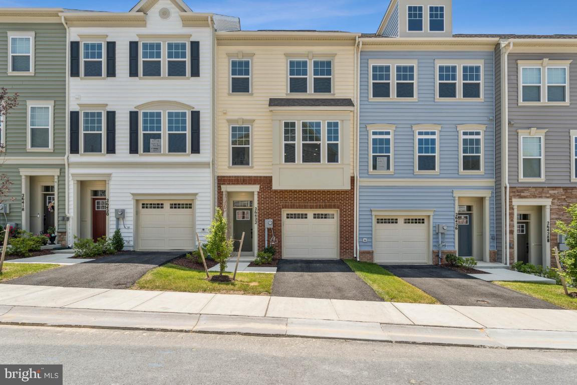 IMMEDIATE DELIVERY - Beautifully designed new construction townhome in the heart of Damascus, MD! This modern 3-bed, 2.5 bath home offers 2017sq. ft. of thoughtfully designed living space, perfect for comfortable and stylish living. As soon as you enter the front door, you are greeted by a bright foyer leading to a lower level rec room, leading out to a private backyard. Heading up the oak staircase to the main living level, you will find an Open-concept floor plan with spacious living and dining areas. The sleek kitchen features an oversized island with quartz countertops, stainless steel appliances & custom cabinetry. The dining room features a box bay window bumpout. The spacious Great Room opens up to a Trex deck overlooking trees. Upstairs, the Luxurious primary suite is complete with a walk-in closet and spa-like en-suite bath. Laundry room is conveniently located upstairs, along with 2 other bedrooms and hall bath. Energy-efficient features including smart home technology and high-performance windows. The exterior includes a 1-car Attached garage and additional parking for convenience, as well as Private outdoor space perfect for relaxing or entertaining. Located in a vibrant new community, this townhome offers easy access to major highways, shopping, dining, and top-rated schools. Enjoy nearby parks, walking trails, and all the charm that Damascus has to offer! Special incentives available for a limited time! Don't miss the opportunity to own this brand-new townhome in a fantastic location. Schedule your tour today!