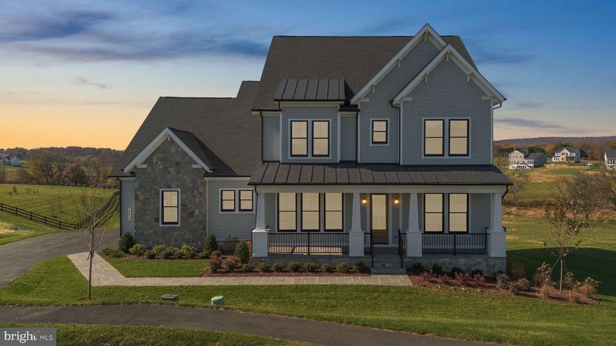 Welcome to this exceptional new construction residence by Van Metre Homes - Design + Build.  The highly sought-after Timberneck+ model is ideally situated on a picturesque 5.77-acre homesite in the Glenmore Farm community in Waterford, VA. The VanMetre Design + Build Team meticulously crafted this gorgeous home, sparing no expense on custom luxury details -- enjoy the superior strength and efficiency provided by 6" exterior walls, complemented by high-end finishes, GE Cafe appliances, and Anderson windows and doors. This stunning Craftsman-style home offers the perfect blend of refined luxury, thoughtful design, and serene countryside living, all within close proximity to Purcellville and the heart of Loudoun County.

A gorgeous flagstone front porch and side-load three-car garage set the tone for the quality and attention to detail found throughout. The main level features an expansive open-concept layout with soaring ceilings and abundant natural light. The gourmet kitchen is a true centerpiece, showcasing quartz countertops, upgraded cabinetry, stainless steel appliances, a large center island, walk-in pantry, and an adjoining casual dining area ideal for everyday living and entertaining. The kitchen opens seamlessly to the spacious great room with fireplace, creating a warm and inviting gathering space.

The main level also includes a private home office with double glass doors, a formal dining room, a mudroom with built-ins, and a main-level bedroom with en-suite bath — perfect for guests or multi-generational living. Step outside to enjoy exceptional outdoor living spaces, including a screened-in porch with an adjacent deck, and peaceful views of rolling open land.

Upstairs, the luxurious primary suite offers a tranquil retreat with dual walk-in closets and spa-inspired bath featuring dual vanities, soaking tub, and separate shower. Additional generously sized bedrooms and well-appointed bathrooms provide comfort and flexibility for a variety of living needs.

The walk-out unfinished lower level offers endless potential for future living space, recreation areas, or additional bedrooms, allowing the next owner to customize to their lifestyle.

Set amidst the natural beauty of western Loudoun County, this property offers privacy, scenic views, and a quiet setting while remaining conveniently close to historic Waterford, Purcellville, local wineries, shops, dining, and commuter routes. A rare opportunity to own a move-in ready brand new luxury home on acreage in one of Loudoun County’s most desirable locations.