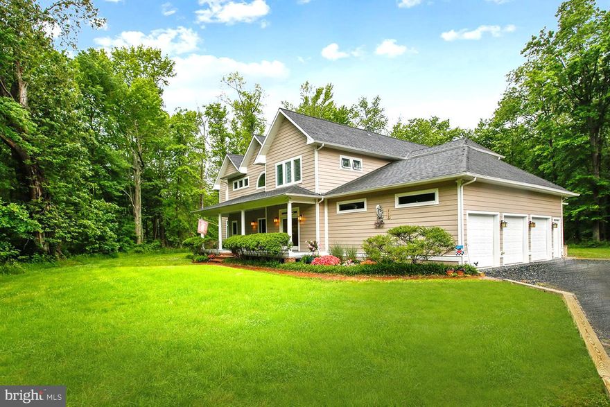 SPRAWLING CAPE COD ON IDYLLIC 6+ ACRES!  TOTAL WOODED PRIVACY JUST 5 MINUTES FROM THE BAY!  Alfresco DINING DECK, SCREENED PORCH, PRIMARY SUITE BALCONY & PLANTATION PORCH overlooking tree-enveloped yard.  Masterfully designed home with luxury detailing!  Rich hardwoods, with vaulted & tray ceilings.  NOTEWORTHY: Two upper level Primary Bedroom Suites w/Baths & bonus Bedroom or Home Office; two main level Bedrooms w/ensuite Baths; cathedral beamed Living Room with brick walls & fireplace; formal Dining Room & Butler’s Pantry; open chef’s granite/stainless Kitchen with dining bar & bistro dining area spilling outdoors; Family Room for home theater/media.  Innovative spaces providing lots of living options including possible Rec Room/Gym & Office/Computer Hub!  No need for a finished basement!  Ample closet storage & walk-in closets!  Multi-vehicle driveway & RARE 3-CAR GARAGE.  CELEBRATE THE CHESAPEAKE SEASONS!!  BREATHE