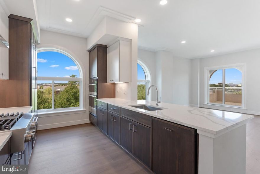 Brand New and Ready for Move In with scenic views!  
Stunning 2 bedroom, 2 bathroom condominium residence near the heart of Old Town Alexandria.
Spacious and contemporary flowing floorplan with a plethora of modern finishes and smart home technology! Oak Nature Earth Grey 7" wide plank flooring span the entire home. The kitchen is a chef's dream, complete with state-of-the-art KitchenAid Stainless Steel Appliances and Two Tone , white and stone, Micro Shaker Cabinets which complement the Calacatta Leon Quartz Countertops and backsplash. Stand at the island and look out the living room patio doors for breath taking views of lush trees and the park and trail! Full sized balcony is perfect for relaxing or entertaining! 
Both bathrooms offer Blanc White Glacier Matte Tiles and Stellar White Quartz countertops.  Laundry room with stacked Full size washer and dryer complete this perfect home.
Towngate North has it all! Fitness studio with yoga room, furnished conference space, clubroom, bike storage and repair room, concierge and even a dog spa! Plus grill on the rooftop terrace while enjoying the views of the DC skyline and Potomac River! 
Towngate North's location will also exceed expectations.  Not only is there quick access to major thoroughfares, but just step outside to the Mount Vernon Trail, numerous local parks, restaurants, boutiques and historical landmarks plus walking distance to the metro and just a few miles from Washington DC, National Harbor and Ronald Reagan Airport. Its all here at Towngate North, ready for you to call home!