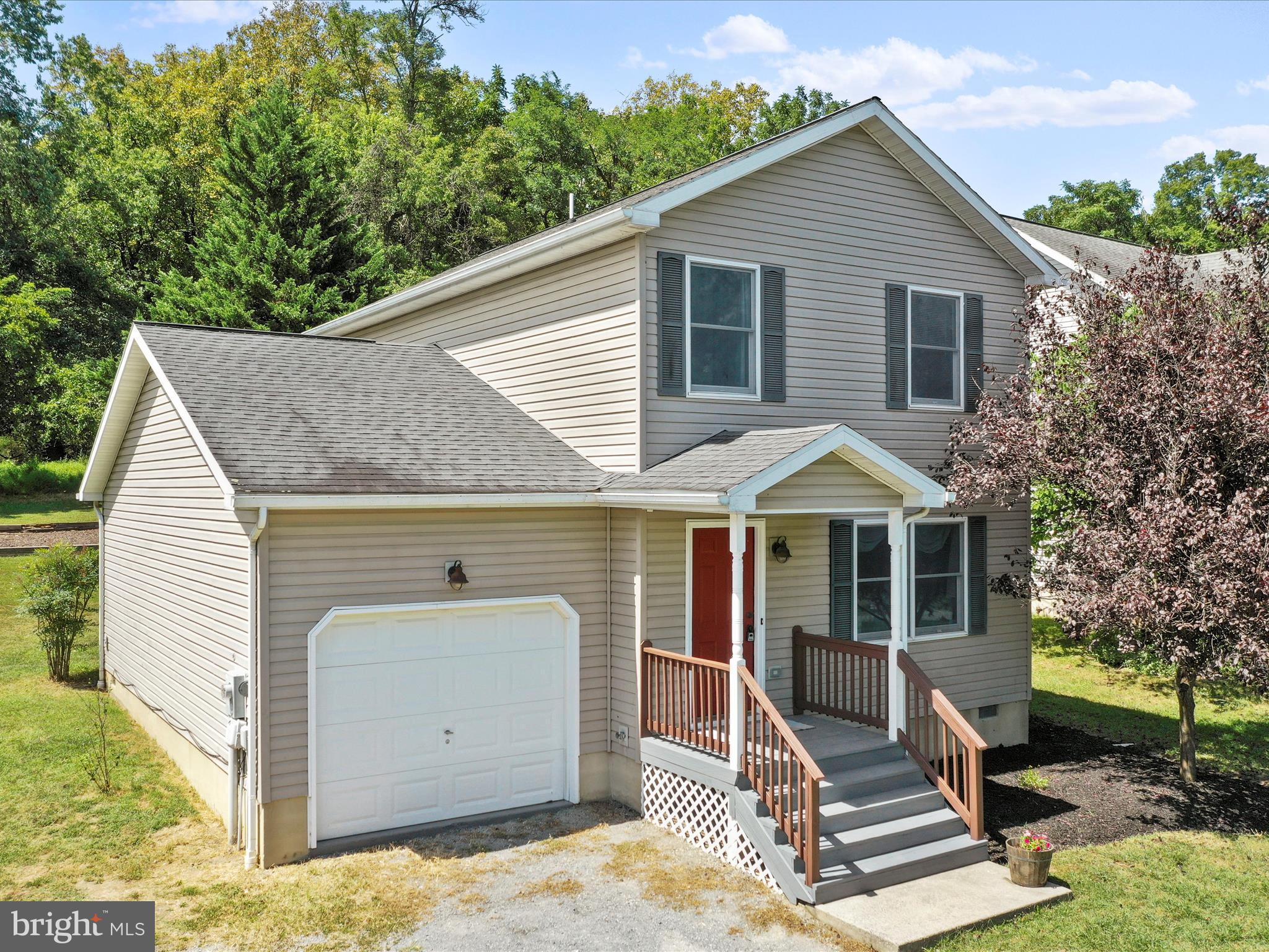 Location, Location, Location. You are going to love where you live. This Cute home offers NO HOA. If you are looking for a 3-4 Bedroom home 2 1/2 Bath MOVE-IN Ready home with a finished 1-Car Garage with lots of additional parking in driveway if you have multiple vehicles. schedule your appointment today. This home is situated on a 0.24 acre lot that backs up to wooded area giving you the privacy you want. The Backyard is ready for you to bring your own ideas. Maybe you dream of having a small garden, a place to entertain and enjoy the mountain views and wildlife. This home has been professionally painted inside, new carpet upstairs in all 3 bedrooms, new flooring in bathrooms, new toilet in primary bathroom, stainless steel appliances in the kitchen. There is a washer and dryer that conveys. Built-in Cabinets in the laundry room you also have great views looking out into the backyard and watch the wildlife. The Kitchen offers 2-lazy Susan Cabinets (corners), lots of cabinets and open space. There is a Sunroom with amazing views into the backyard. This could be a den/office, current owners used as a main floor bedroom. There is so much to love here. The Covered Front porch is perfect for enjoying your morning coffee or enjoying those mountain views. Nearby amenities that you can walk to include restaurants, walking/hiking trails, convenience stores, coffee /Bakery shops to name a few. If you are a commuter to MD/DC/VA/WV the Marc Train is nearby. This property really is unique and is A Must See. Move-In Ready , NO HOA, Location, Location this one checks the boxes. Public Water, Public Sewer. Let the Country Roads Bring you Home. Only an hour from the DC area. Motivated Sellers Bring any and all reasonable offers.