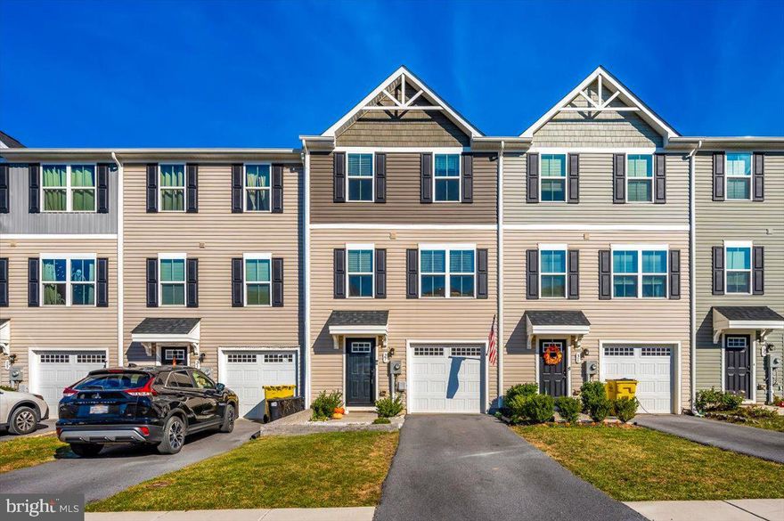 Welcome to this charming 3-bedroom, 2.5-bath townhome in the popular Lakes at Martinsburg community! This home has everything you need and more. Step out back to find a fully fenced yard with a 6-foot privacy fence—perfect for pets or just enjoying some outdoor time. The Trex deck, complete with stairs leading to the yard, is a standout feature that makes outdoor living easy. Inside, the lower level greets you with stylish LVP flooring and offers a finished rec room with walkout access to the backyard. You'll also have the convenience of an attached 1-car garage. Head up to the main level to find a bright, welcoming eat-in kitchen, complete with stainless steel appliances and a handy island for extra prep space. The upper floor is all about comfort, with a spacious primary suite featuring a walk-in closet and an en-suite bathroom. Two more roomy bedrooms, an additional full bath, and an upstairs laundry area make everyday living that much easier. This home has been lovingly maintained and is ready for you to move right in. Come see it for yourself and fall in love!